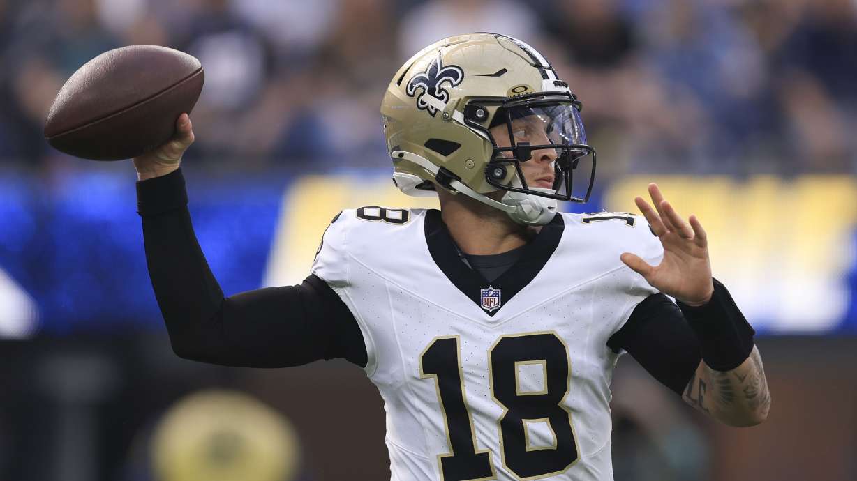 New Orleans Saints quarterback Spencer Rattler (18) passes in the first half of an NFL football game against the Los Angeles Chargers in Inglewood, Calif., Sunday, Oct. 27, 2024.