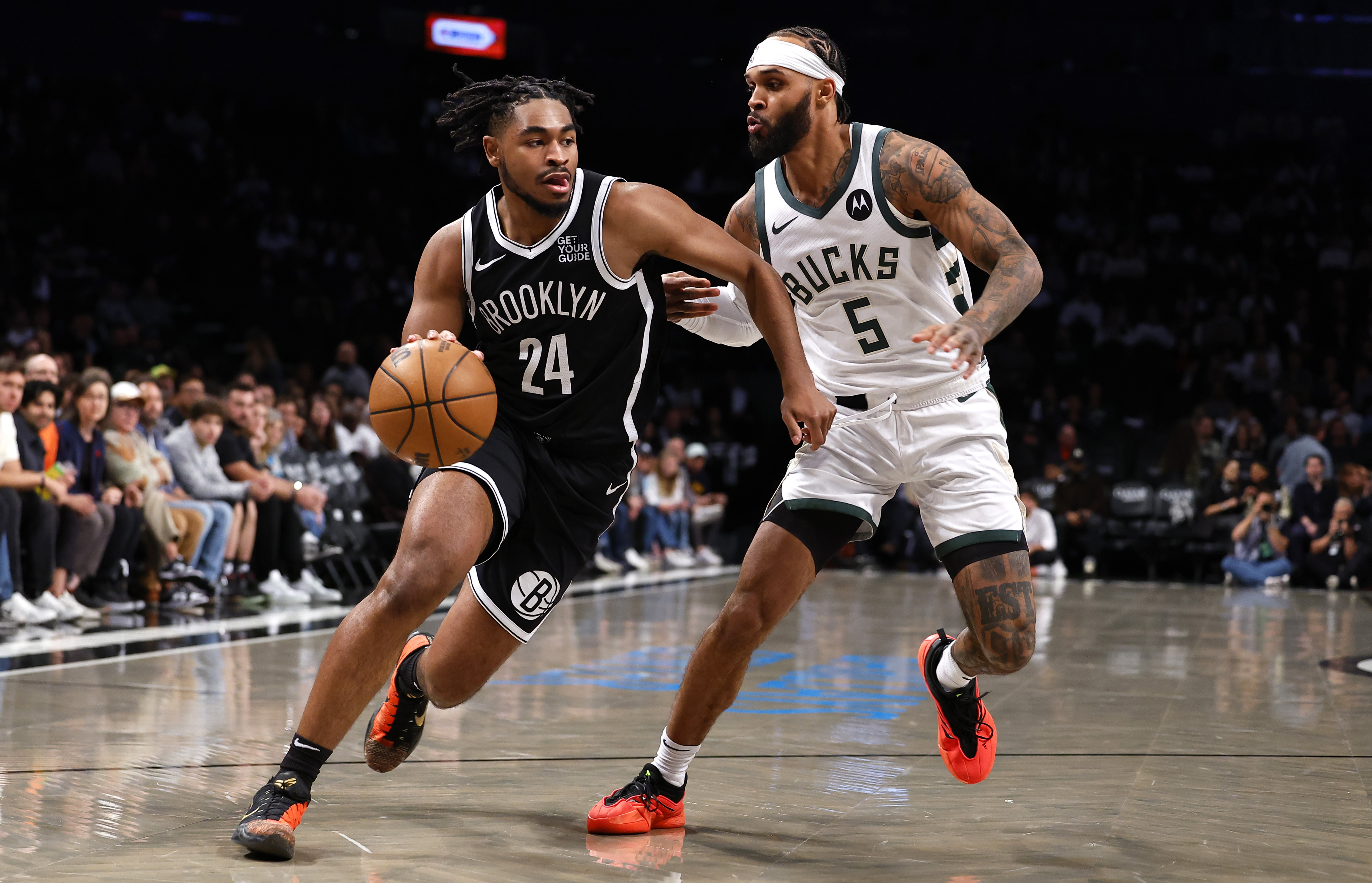 Brooklyn Nets guard Cam Thomas (24) drives to the basket against Milwaukee Bucks guard Gary Trent Jr. (5) during the first half of an NBA basketball game, Sunday, Oct. 27, 2024, in New York. 