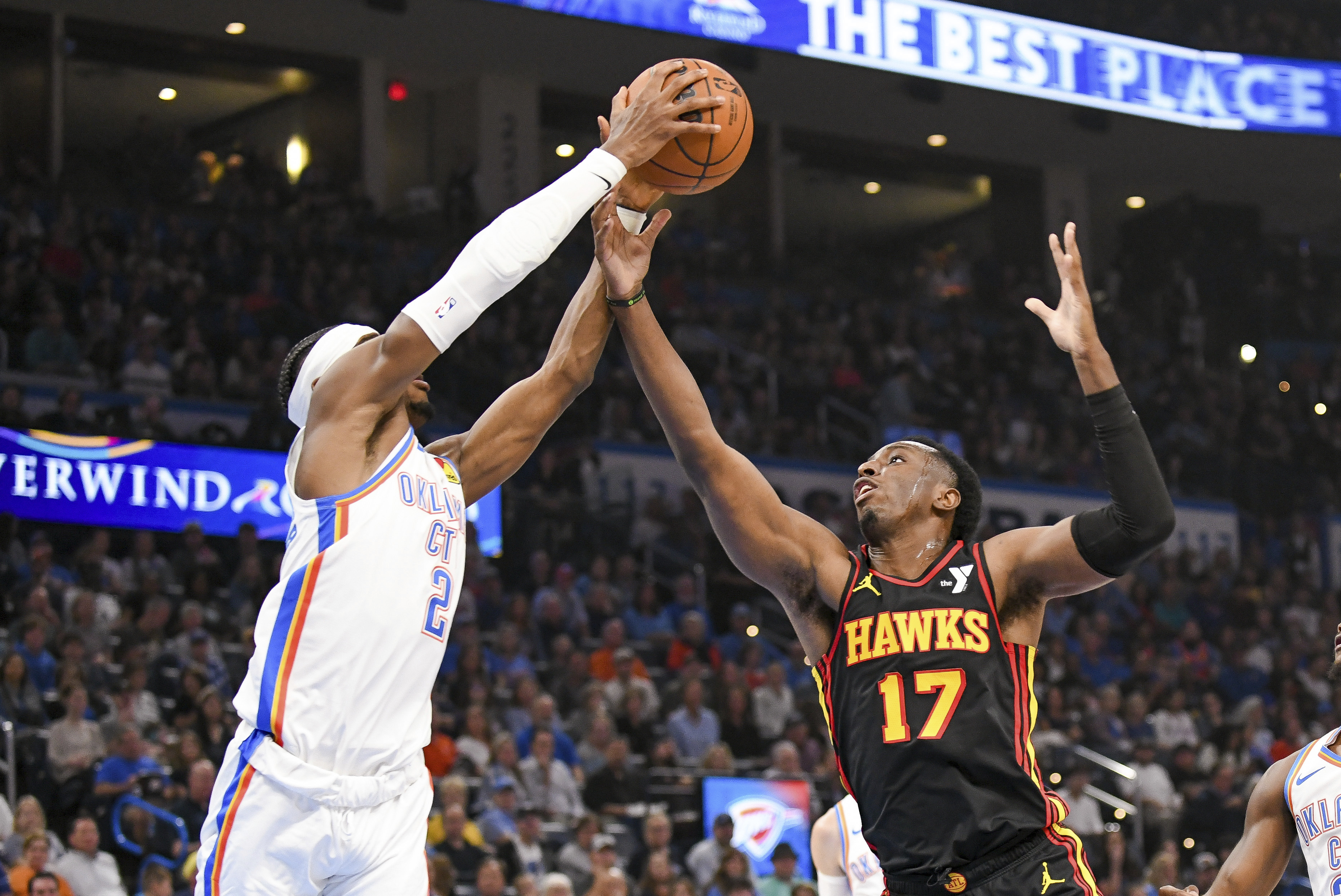 Oklahoma City Thunder guard Shai Gilgeous-Alexander (2) steals a pass from Atlanta Hawks forward Onyeka Okongwu (17) during the first half of an NBA basketball game, Sunday, Oct. 27, 2024, in Oklahoma City. 