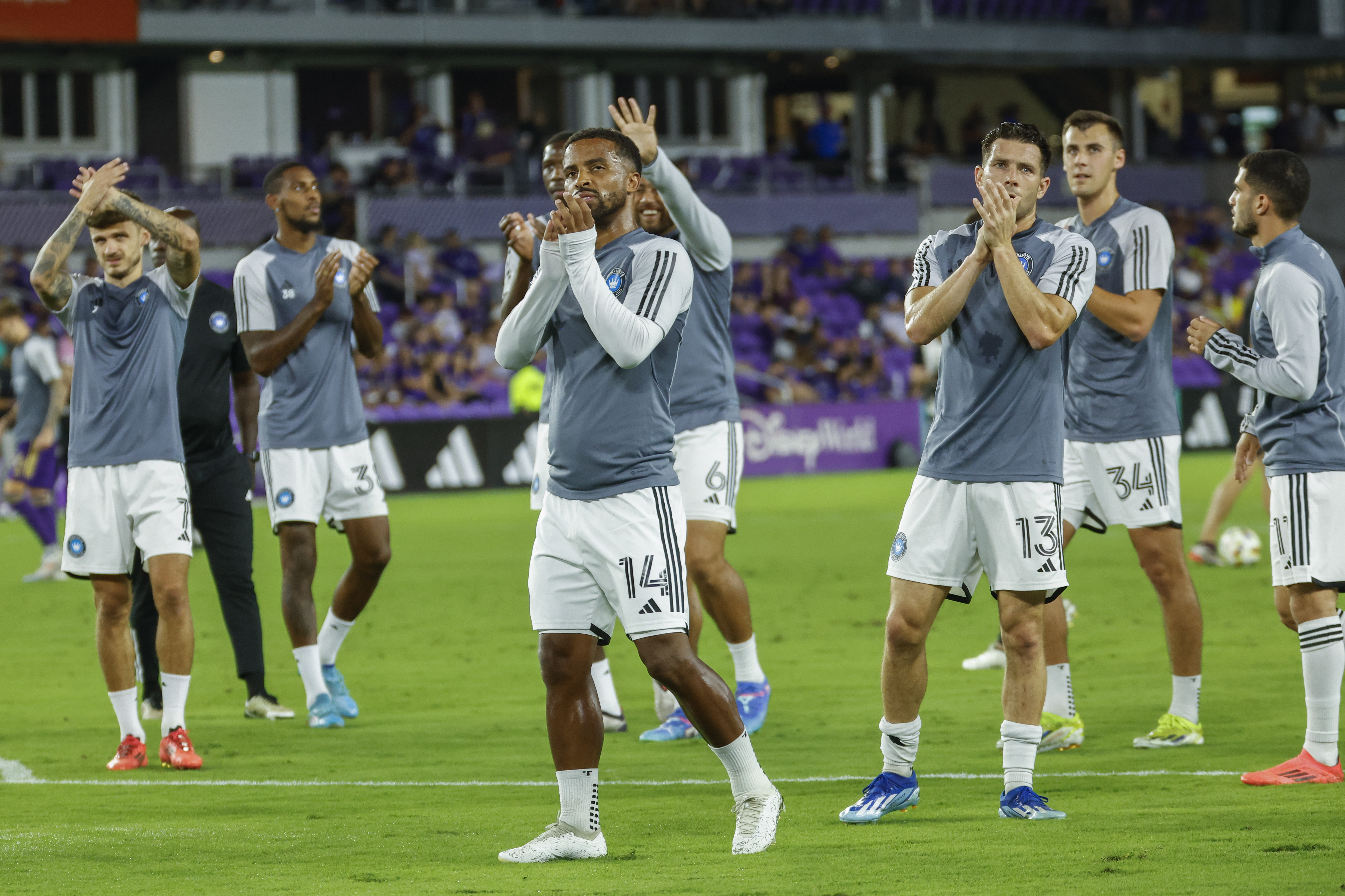 Charlotte FC players acknowledge their fans before a best-of-three first-round soccer match against Orlando City for the MLS Cup, Sunday, Oct. 27, 2024, in Orlando, Fla. 