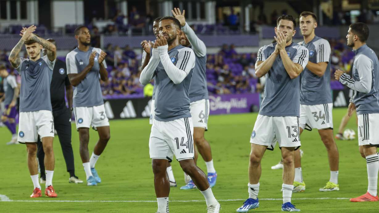 Charlotte FC players acknowledge their fans before a best-of-three first-round soccer match against Orlando City for the MLS Cup, Sunday, Oct. 27, 2024, in Orlando, Fla.