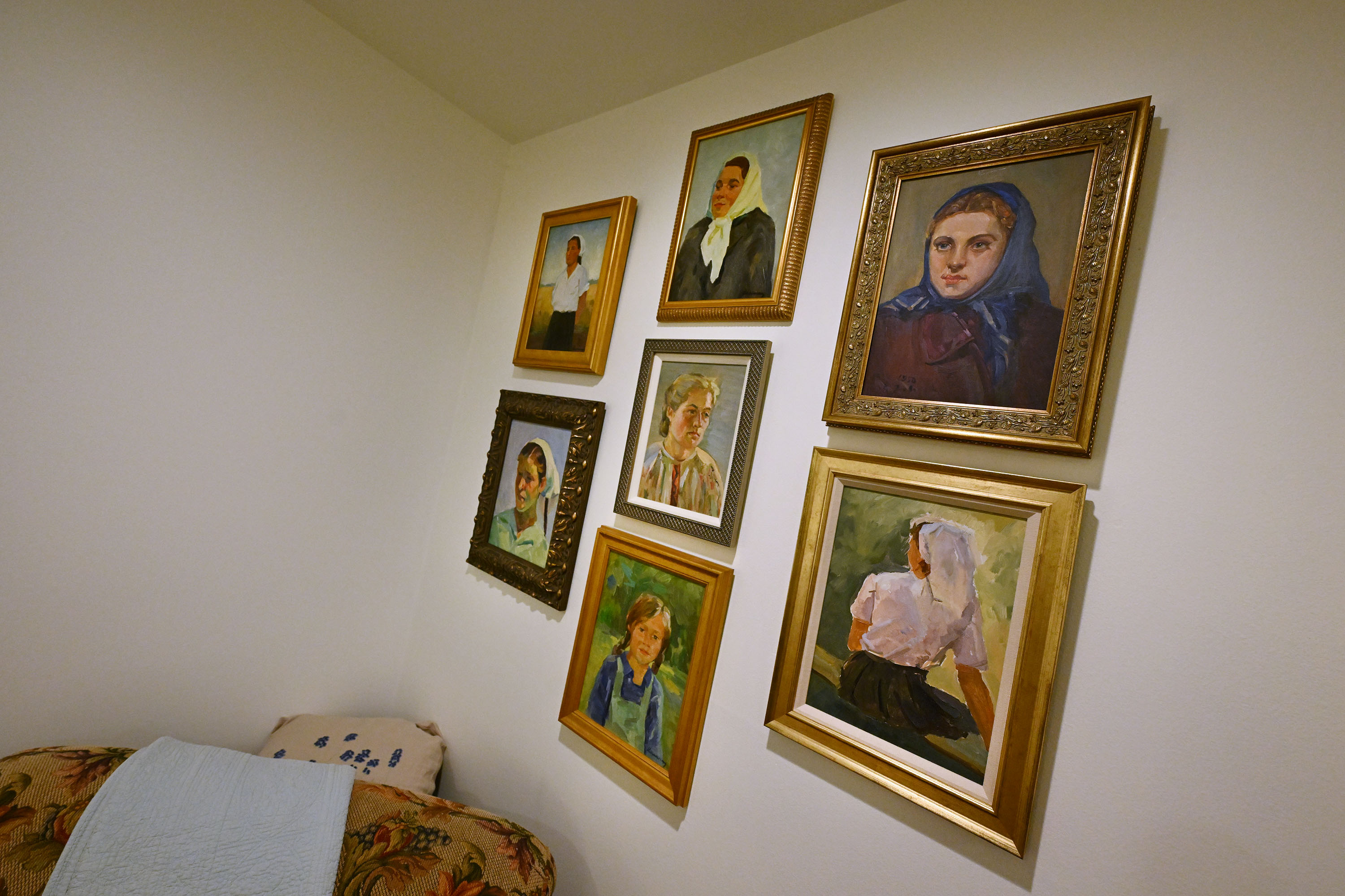 Pieces by several artists hang in Mary Milliner’s home. She and her sisters Sarah Dansie and Marta Dansie work to import art from Ukraine to raise money for the war effort.