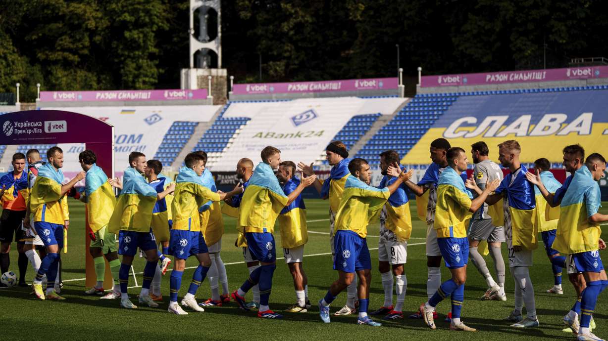 Soccer players of Dynamo Kyiv and Zorya Luhansk great each other before game of Ukrainian Premier League in Kyiv, Ukraine, Saturday Sept. 14, 2024.