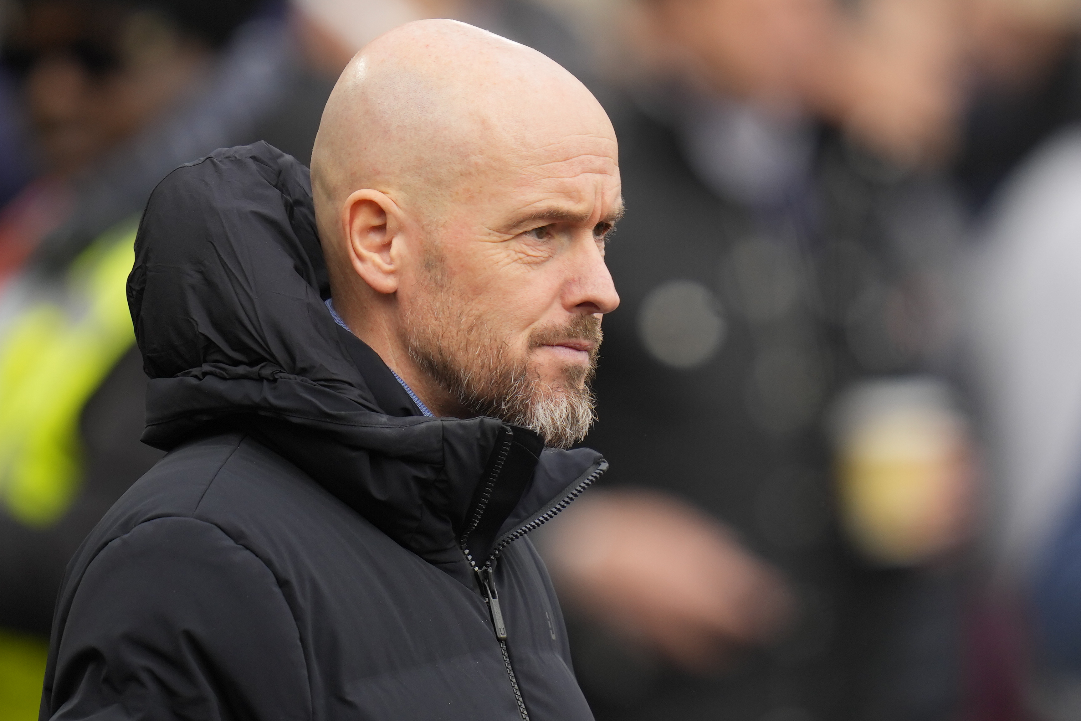 Manchester United's head coach Erik ten Hag looks from the bench before the English Premier League soccer match between West Ham United and Manchester United at the London stadium in London, Saturday, Dec. 23, 2023.
