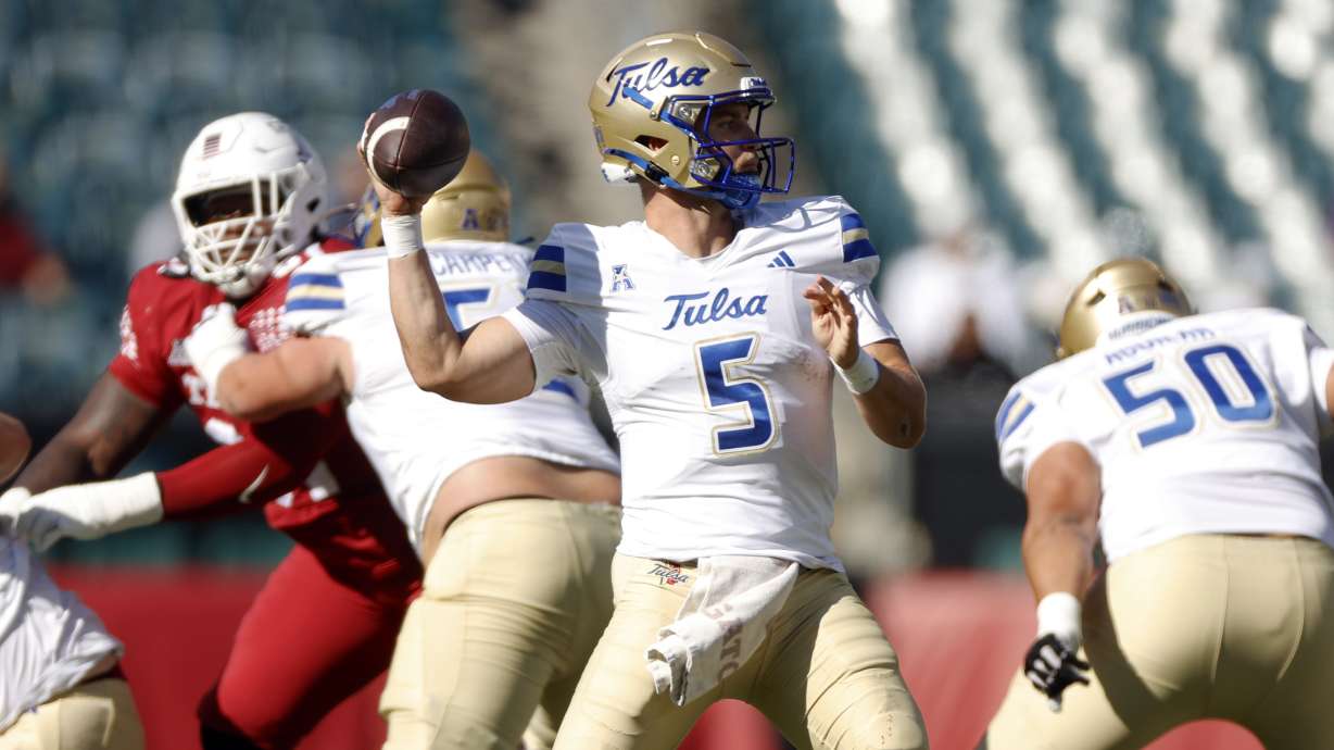 FILE - Tulsa quarterback Cooper Legas looks for an open receiver while facing Temple during an NCAA football game on Saturday, Oct. 19, 2024, in Philadelphia.