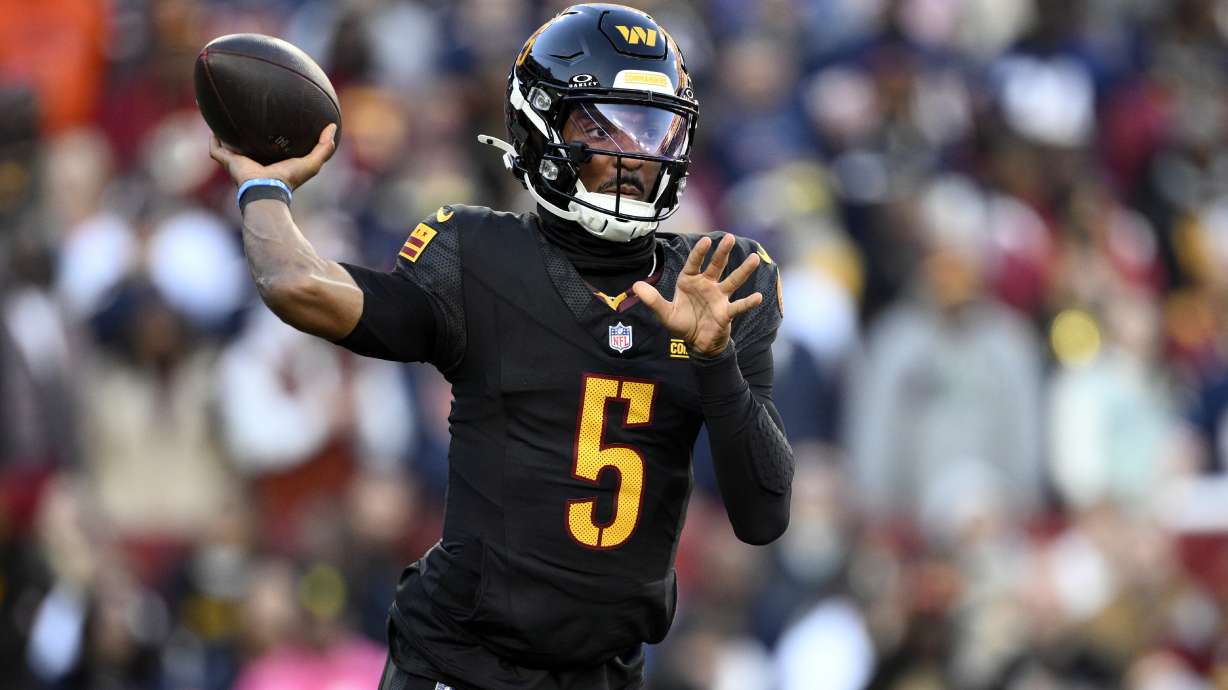 Washington Commanders quarterback Jayden Daniels passes against the Chicago Bears in the first half of an NFL football game Sunday, Oct. 27, 2024, in Landover, Md.