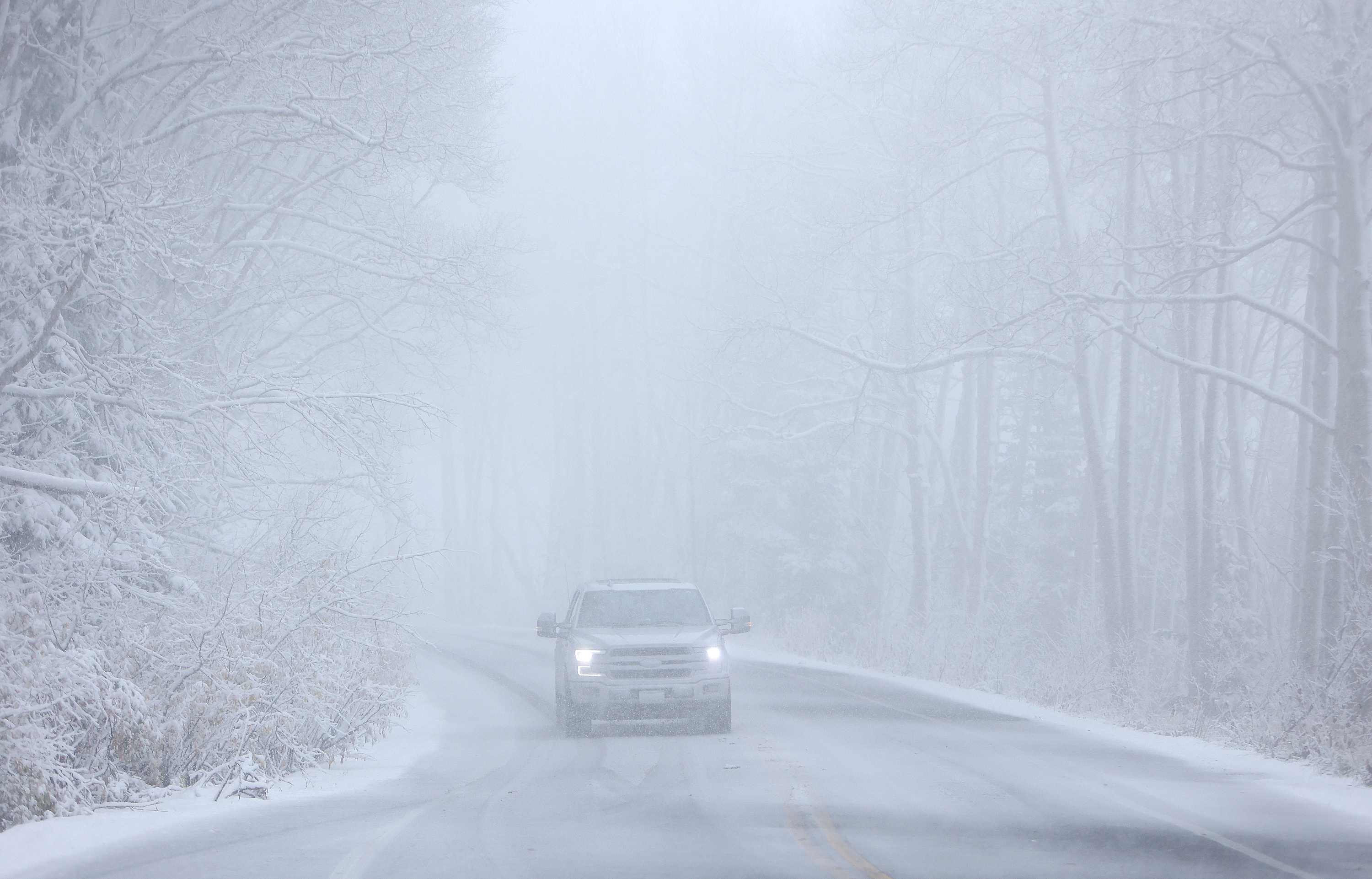 A driver navigates a snow storm on Guardsman Pass on Oct. 17. Utah's mountains are forecast to receive another snow coating from a storm arriving Monday evening. 