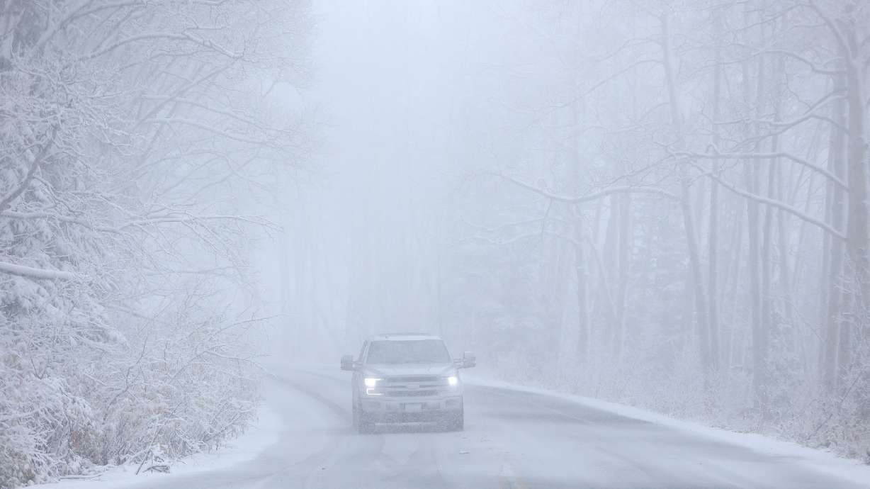 A driver navigates a snow storm on Guardsman Pass on Oct. 17. Utah's mountains are forecast to receive another snow coating from a storm arriving Monday evening.