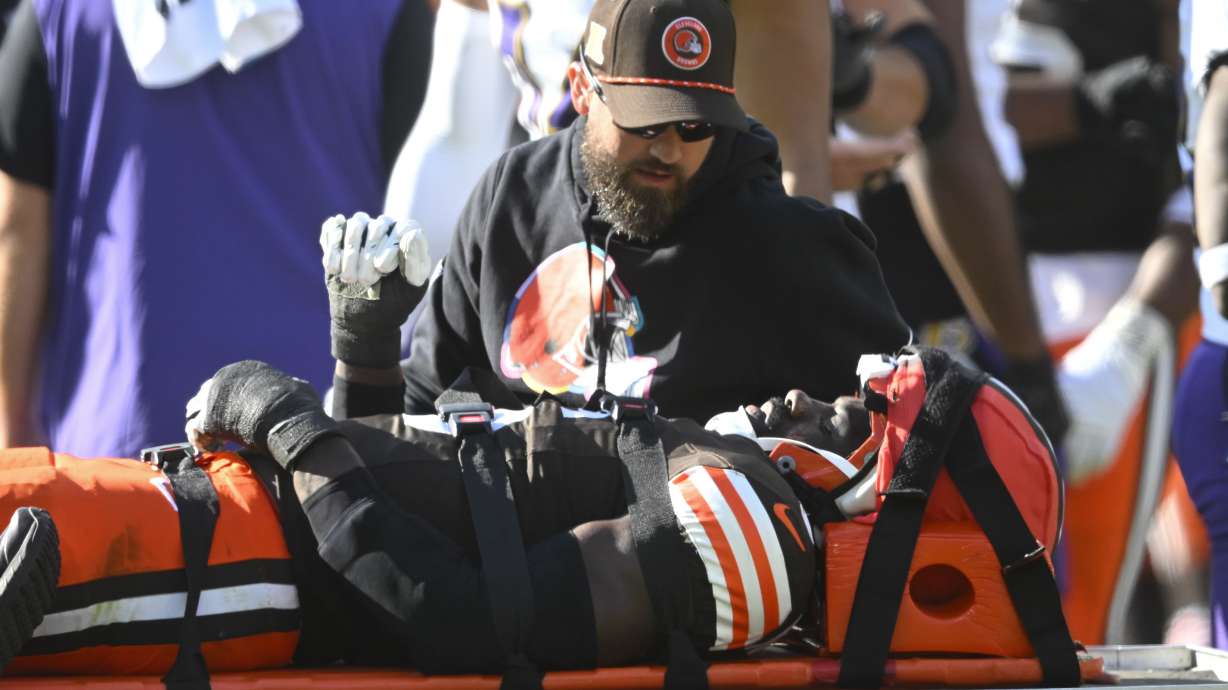 Cleveland Browns linebacker Jeremiah Owusu-Koramoah (6) is taken off the field during the second half of an NFL football game against the Baltimore Ravens in Cleveland, Sunday, Oct. 27, 2024.