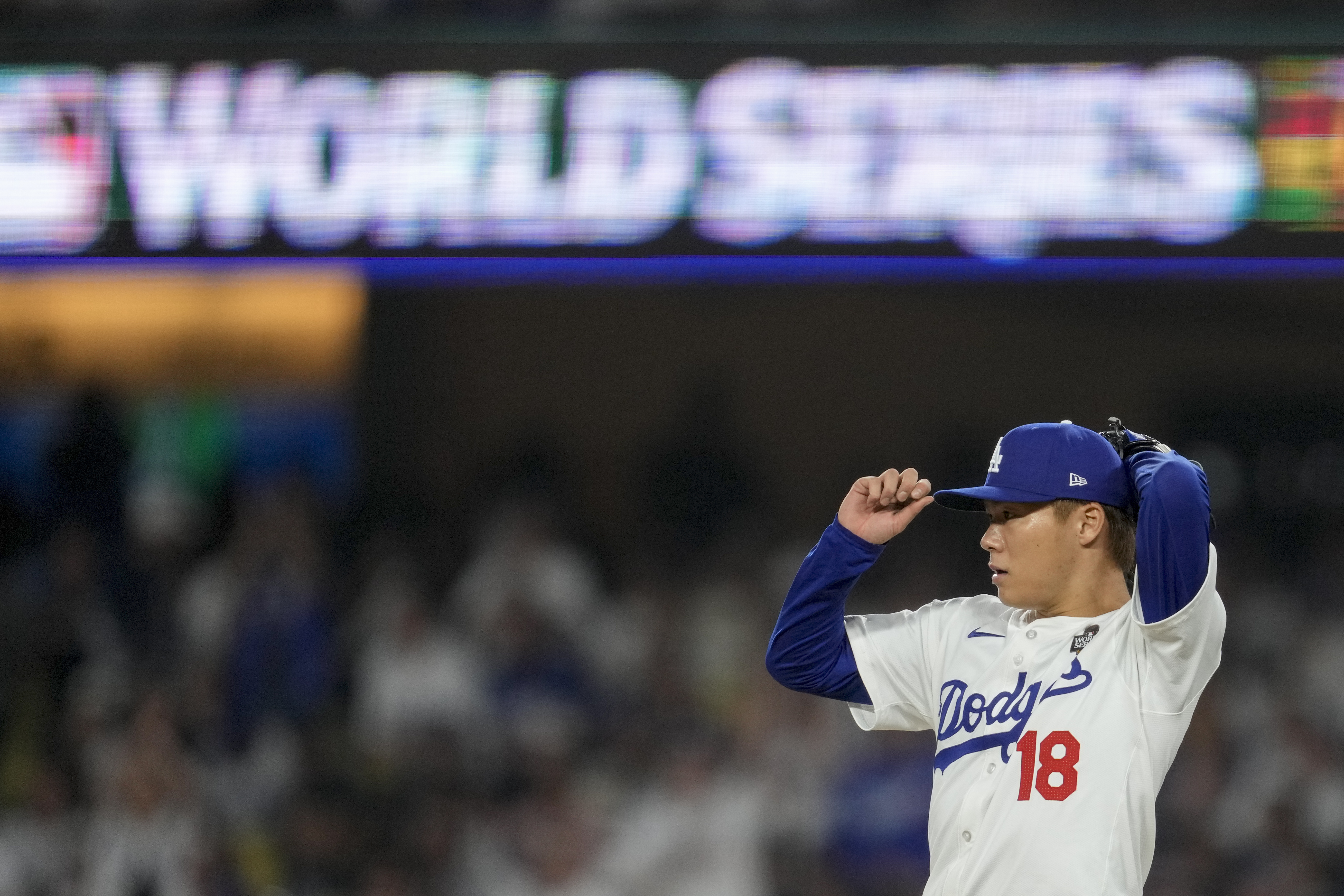 Los Angeles Dodgers pitcher Yoshinobu Yamamoto leaves the games against the New York Yankees during the seventh inning in Game 2 of the baseball World Series, Saturday, Oct. 26, 2024, in Los Angeles.