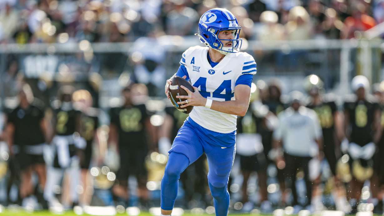 BYU kicker Will Ferrin looks to throw before running for eight yards on a fake field goal during a Big 12 college football game against UCF, Saturday, Oct. 26, 2024 at FBC Mortgage Stadium in Orlando, Florida.