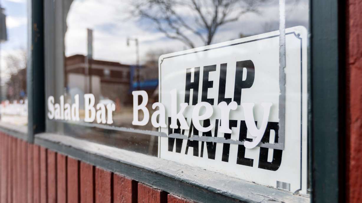 A "Help Wanted" sign is seen in the window at the Soup Kitchen in Salt Lake City on Feb. 9.