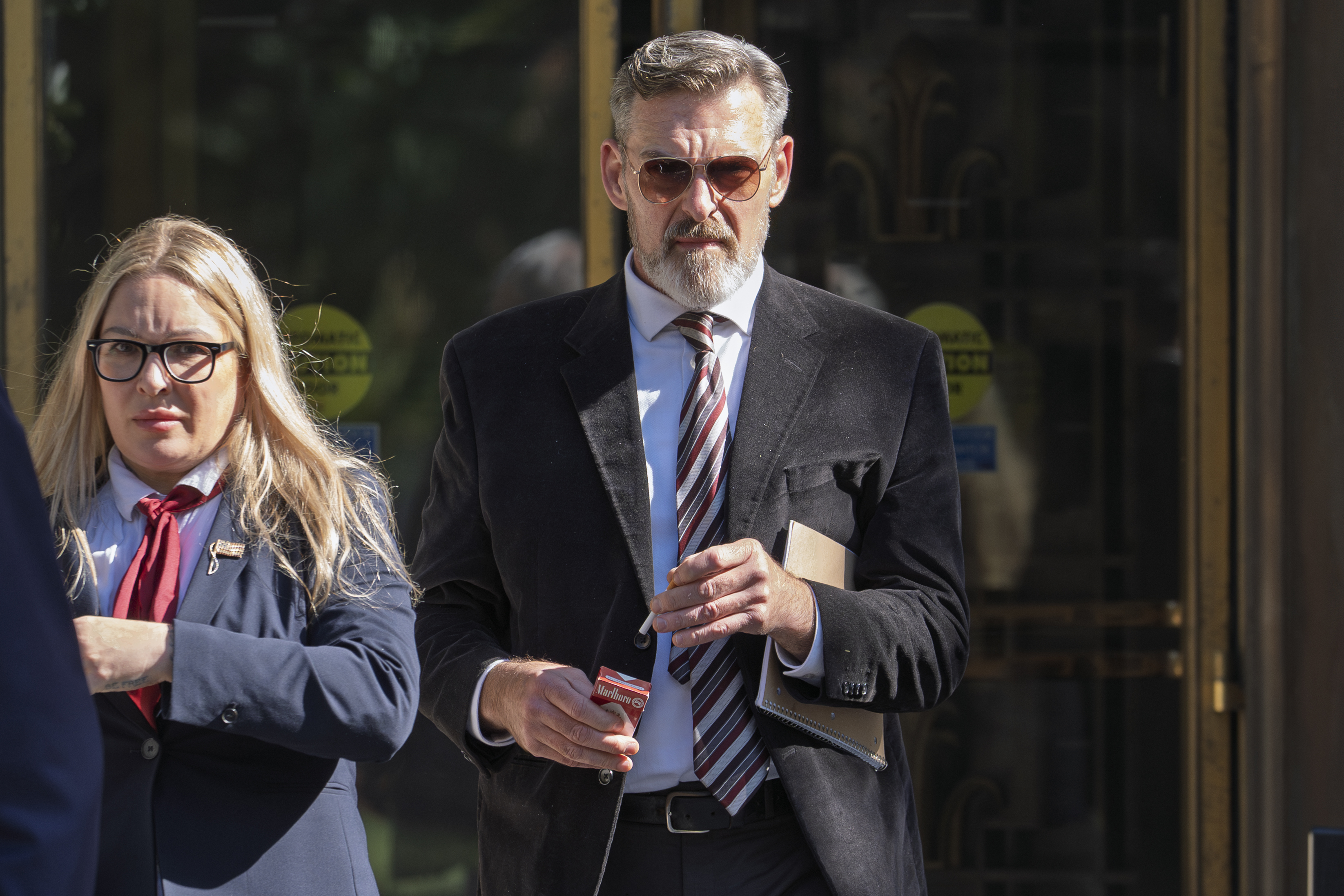 Actor Jay Johnston emerges from the U.S. District Courthouse in Washington, Monday after being sentenced to one year in prison for his part in a mob’s attack on the U.S. Capitol nearly four years ago.