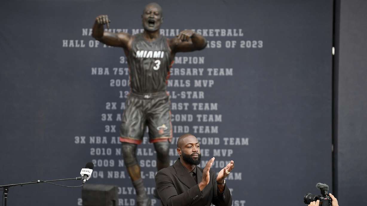 Former Miami Heat NBA basketball player Dwyane Wade thanks the crowd during his statue unveiling ceremony outside Kaseya Center, Sunday, Oct. 27, 2024, in Miami, Fla.