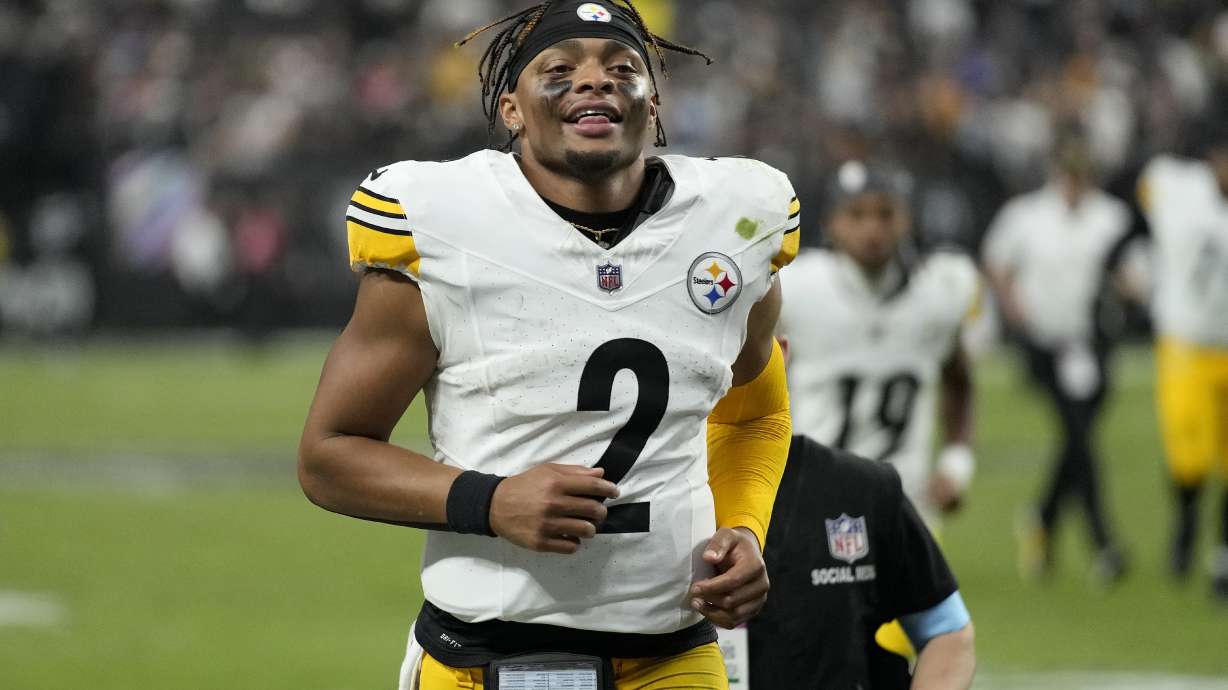 Pittsburgh Steelers quarterback Justin Fields (2) smiles as he jogs off the field after an NFL football game against the Las Vegas Raiders in Las Vegas, Sunday, Oct. 13, 2024.