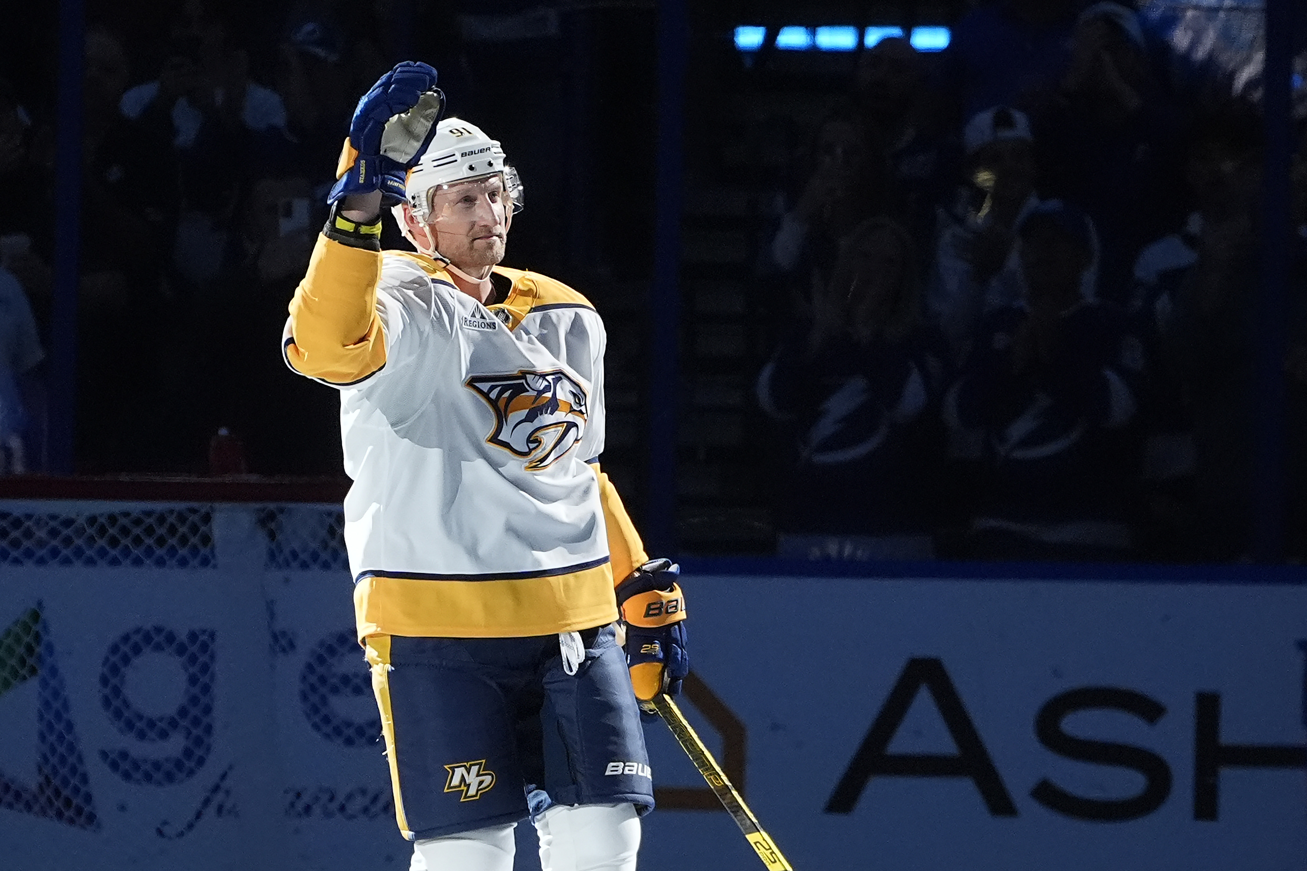 Nashville Predators center Steven Stamkos (91) waves to the crowd after a video tribute during the first period of an NHL hockey game against the Tampa Bay Lightning Monday, Oct. 28, 2024, in Tampa, Fla. Stamkos played for the Lightning for 16-seasons. 