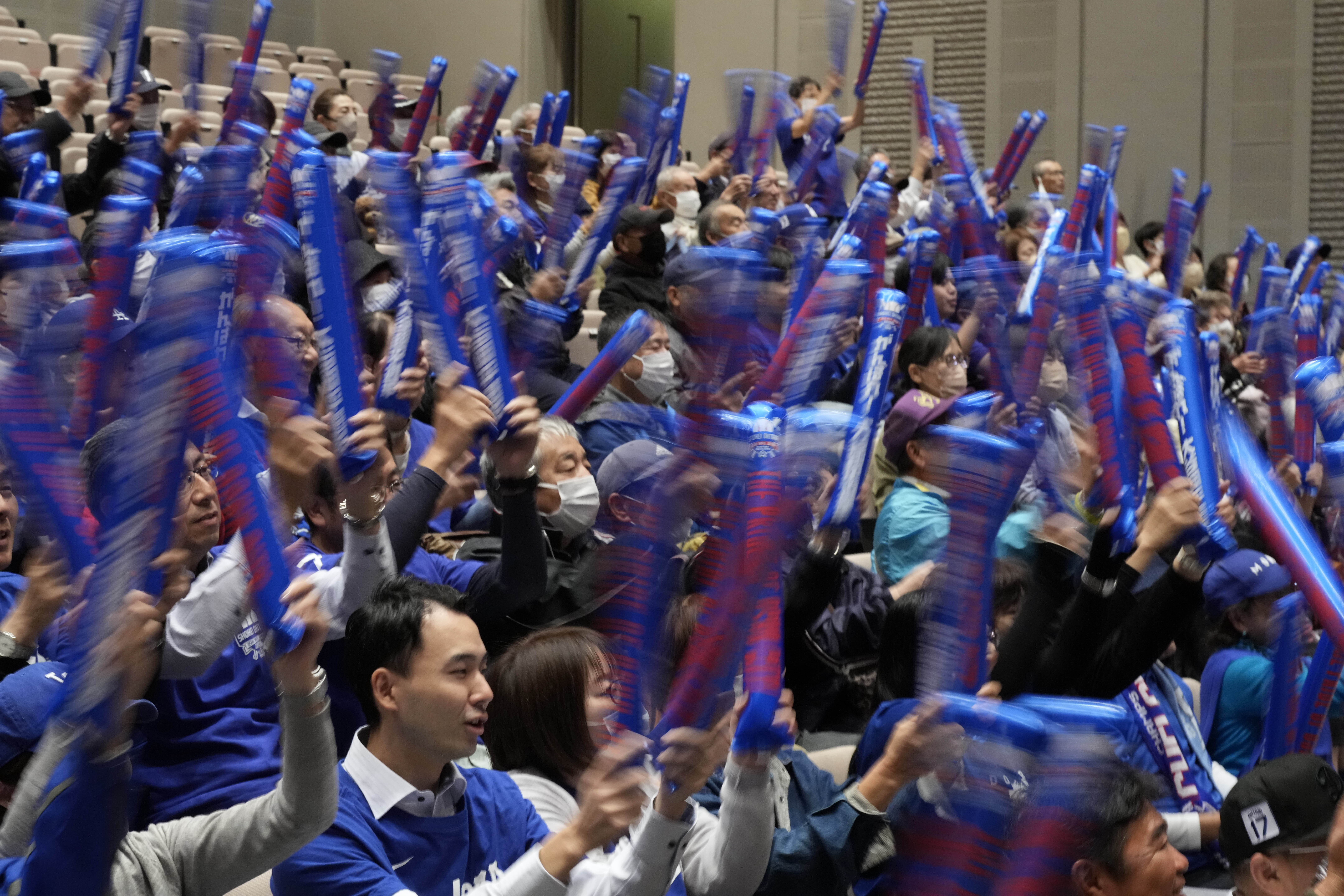 CORRECTS THE TIMING WAS BEFORE THE GAME STARTS - People watch on a live stream before the start of Game 3 of the baseball World Series between Los Angeles Dodgers and New York Yankees during a public viewing event in Oshu, northeastern Japan, the hometown of Shohei Ohtani of the Los Angeles Dodgers, Tuesday, Oct. 29, 2024. 