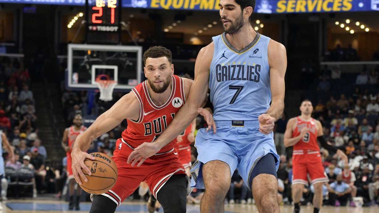 Chicago Bulls guard Zach LaVine handles the ball against Memphis Grizzlies forward Santi Aldama (7) in the first half of an NBA basketball game Monday, Oct. 28, 2024, in Memphis, Tenn.