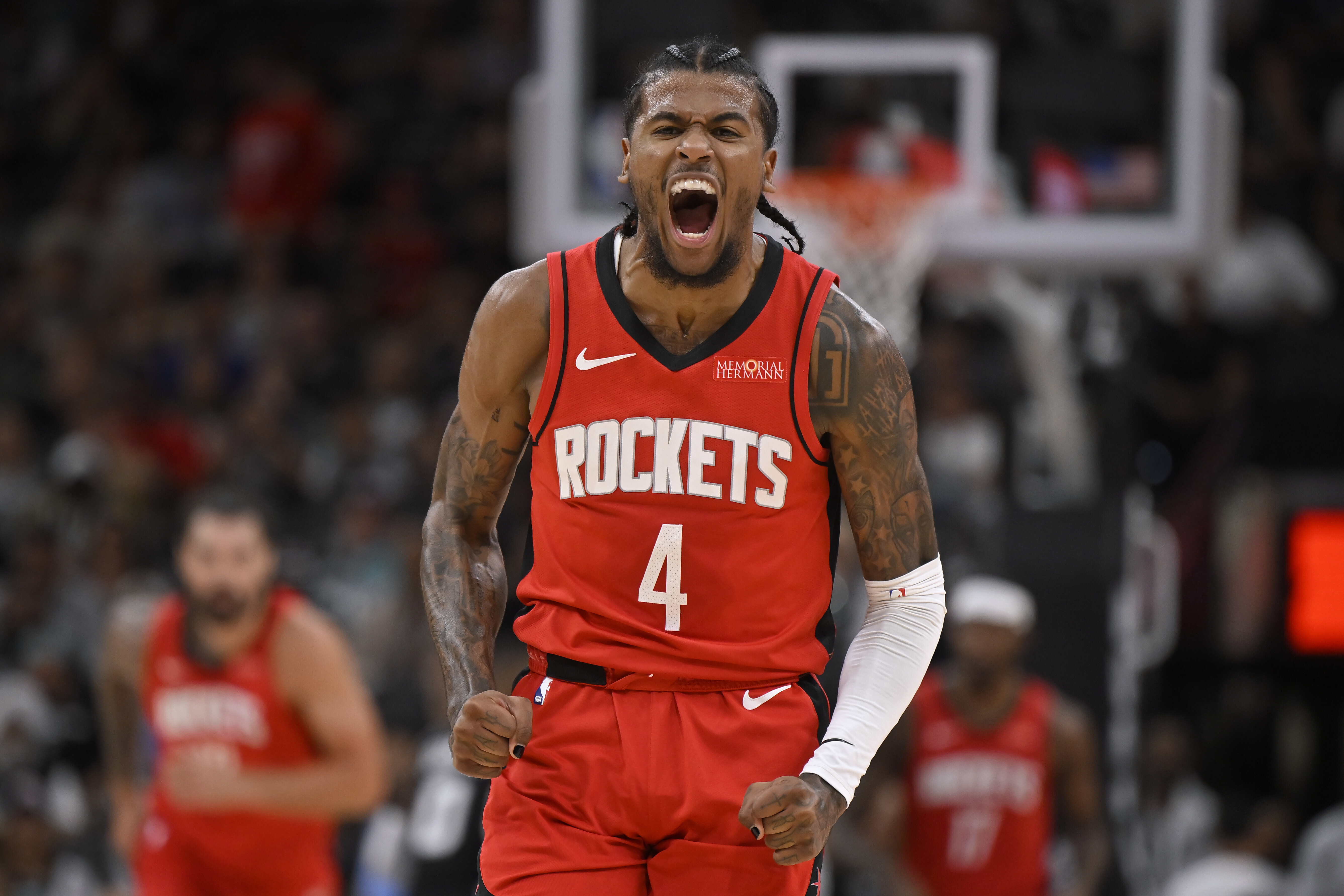 Houston Rockets' Jalen Green celebrates after a 3-point basket during the first half of an NBA basketball game against the San Antonio Spurs, Monday, Oct. 28, 2024, in San Antonio. 