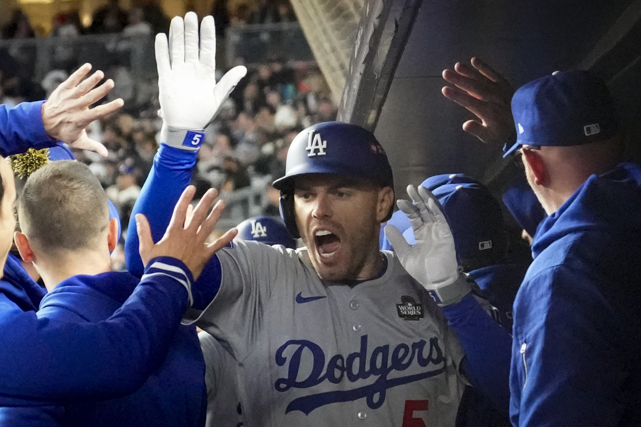 Los Angeles Dodgers' Freddie Freeman celebrates his two-run home run against the New York Yankees during the first inning in Game 3 of the baseball World Series, Monday, Oct. 28, 2024, in New York.