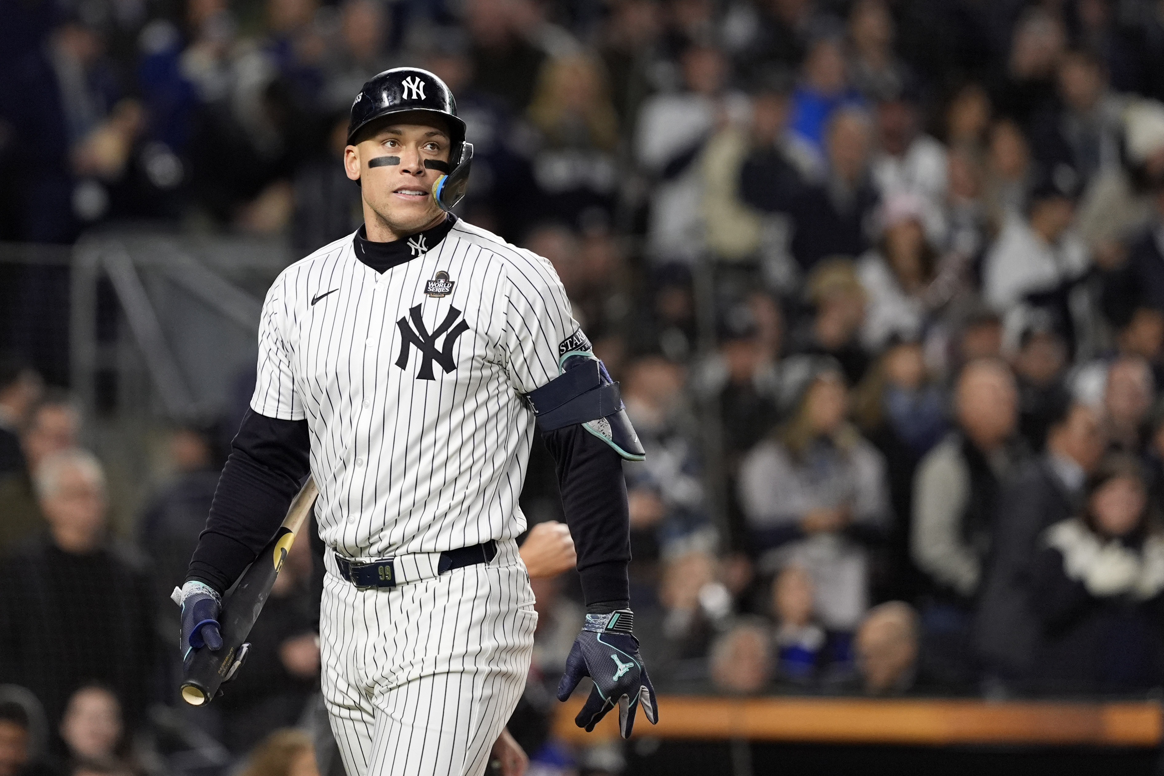 New York Yankees' Aaron Judge walks back to the dugout after striking out against the Los Angeles Dodgers during the first inning in Game 3 of the baseball World Series, Monday, Oct. 28, 2024, in New York. 