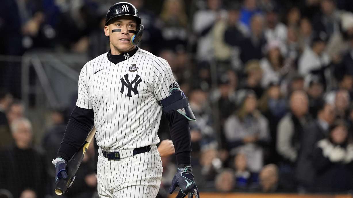 New York Yankees' Aaron Judge walks back to the dugout after striking out against the Los Angeles Dodgers during the first inning in Game 3 of the baseball World Series, Monday, Oct. 28, 2024, in New York.