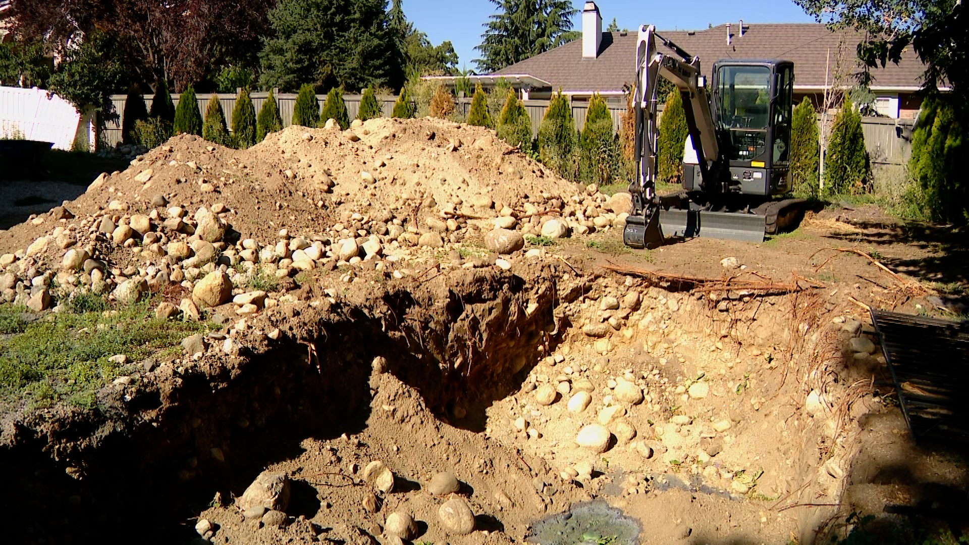 Dennis Deloach says he paid $17,000 for a landscaping renovation to his backyard in Sandy, but the contractor vanished after digging this hole.