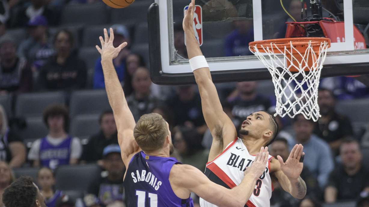 Sacramento Kings forward Domantas Sabonis (11) shoots over Portland Trail Blazers forward Toumani Camara, right, during the first half of an NBA basketball game in Sacramento, Calif., Monday, Oct. 28, 2024.