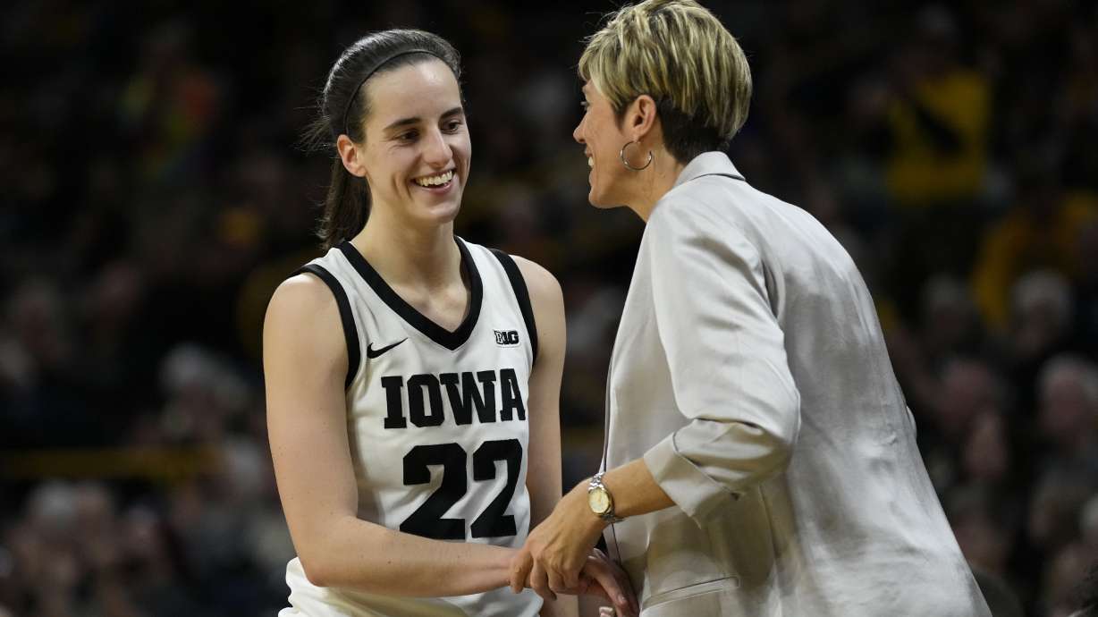 FILE - Iowa guard Caitlin Clark talks with assistant coach Jan Jensen during the second half of an NCAA college basketball game against Drake, Nov. 19, 2023, in Iowa City, Iowa.