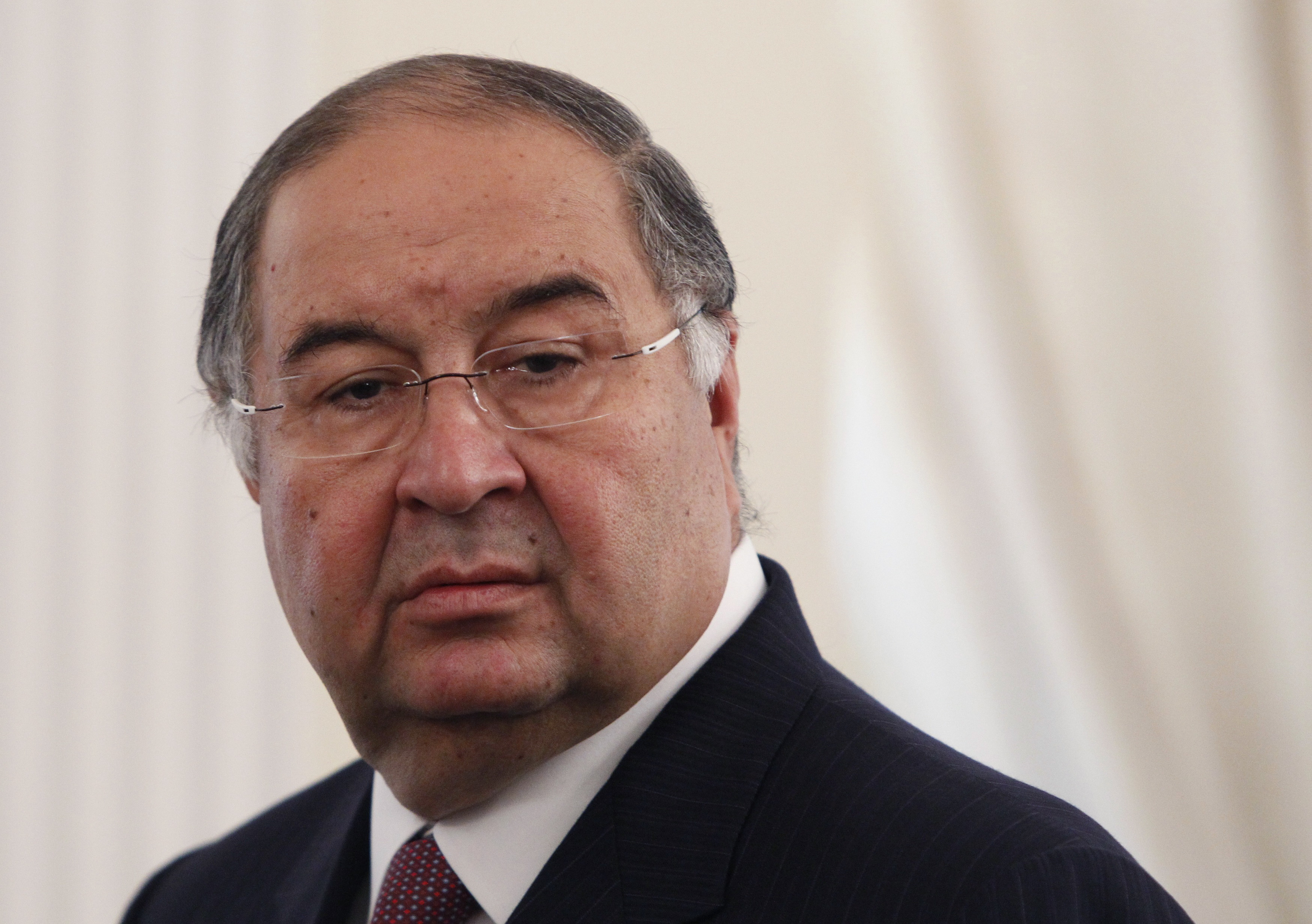 FILE - Uzbek-born Russian businessman Alisher Usmanov attends a meeting of Russian President Vladimir Putin and Crown Prince Sheik Mohammed bin Zayed Al Nahyan of the United Arab Emirates at the Novo-Ogaryovo state residence outside Moscow, Sept. 12, 2013.