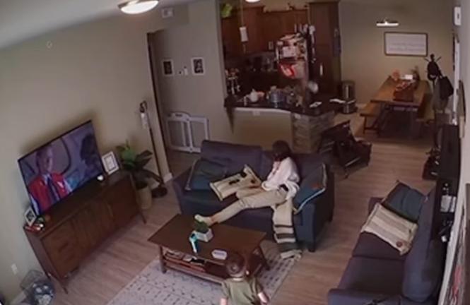 A young boy is throwing a bouncy ball in the house. What could go wrong?