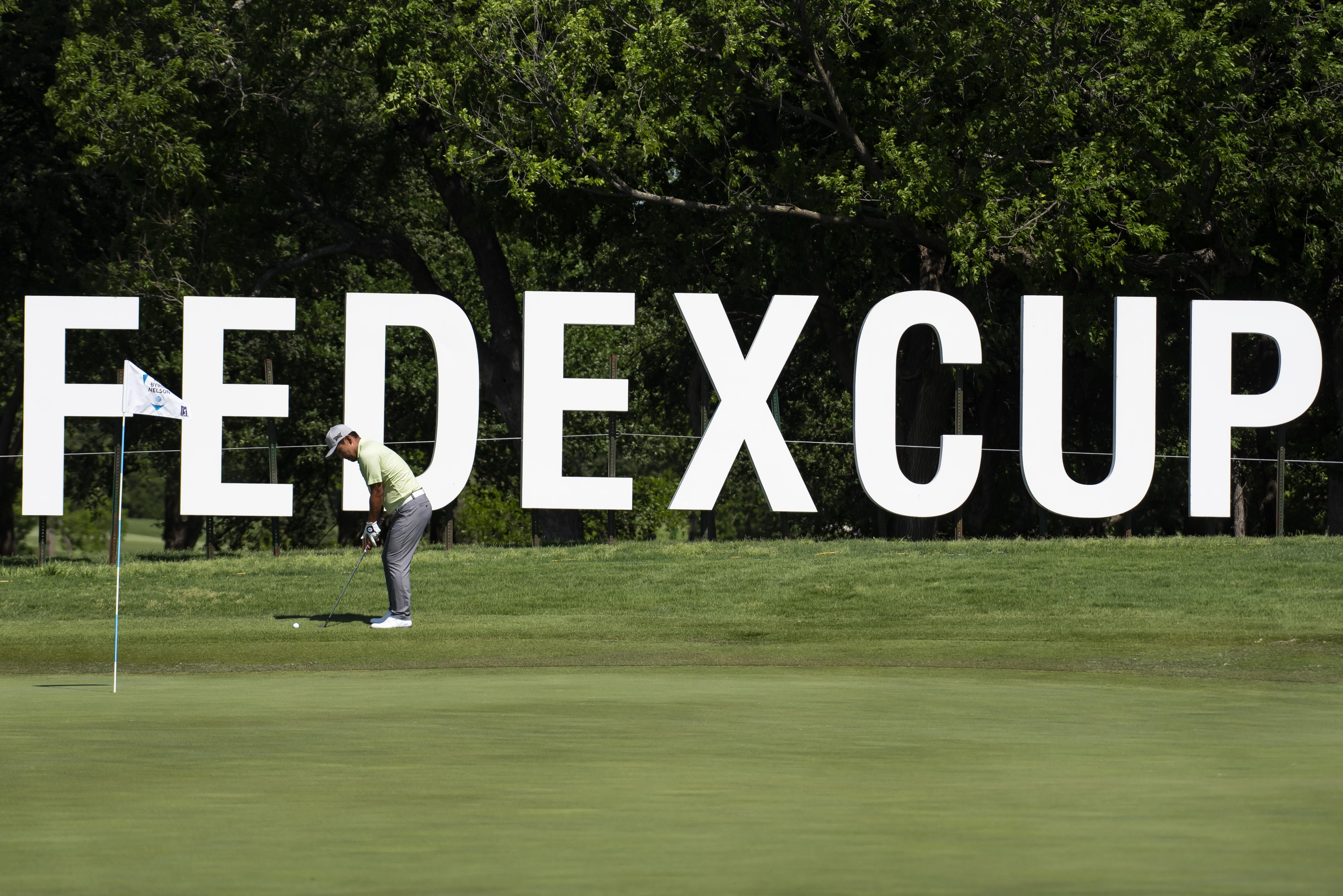 FILE - Sung Kang, of South Korea, hits a shot off of the 10th hole during the first round of the AT&T Byron Nelson golf tournament in McKinney, Texas, on Thursday, May 12, 2022. 