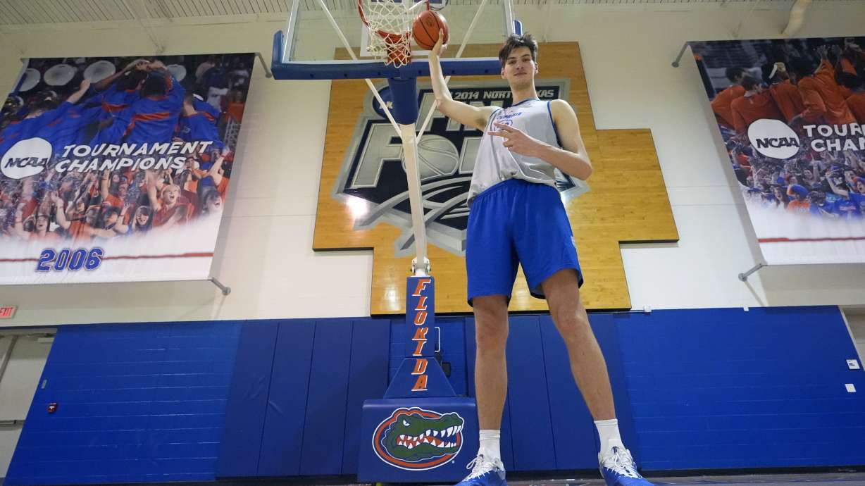 Olivier Rioux, 7-foot-9 NCAA college basketball player at Florida, poses for a photo after practice, Friday, Oct. 18, 2024, in Gainesville, Fla.