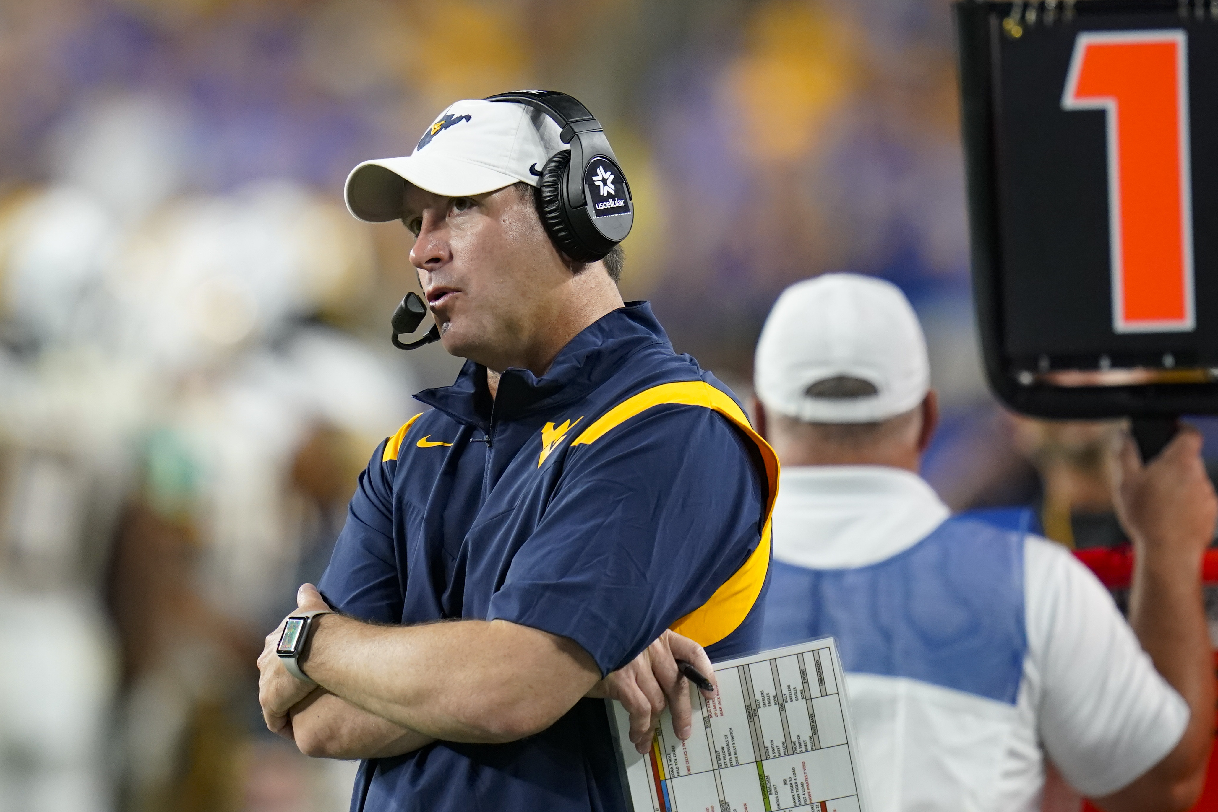 FILE - West Virginia assistant coach Jordan Lesley watches during the second half of the team's NCAA college football game against Pittsburgh, Sept. 1, 2022, in Pittsburgh.