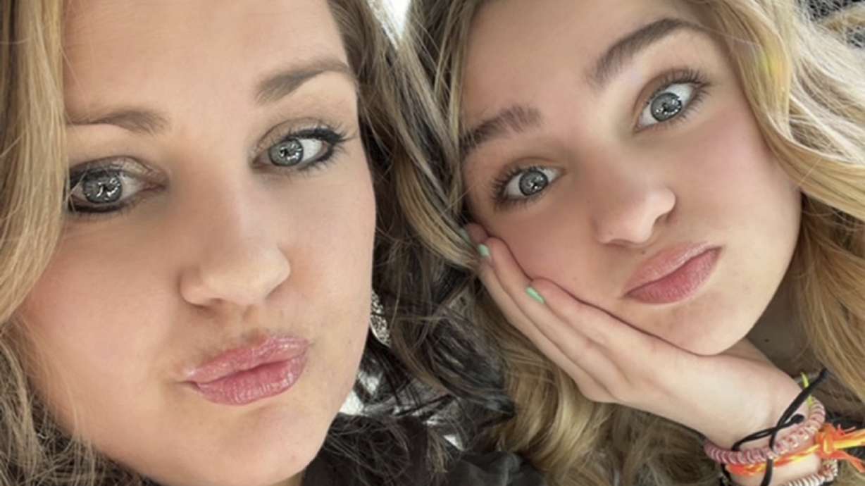 Brittany Randall, left, and her daughter, Kamberlyn Bowler, pose for a selfie photo in Grand Junction, Colo. Bowler is hospitalized with severe complications of E. coli food poisoning in an outbreak linked to McDonald's.