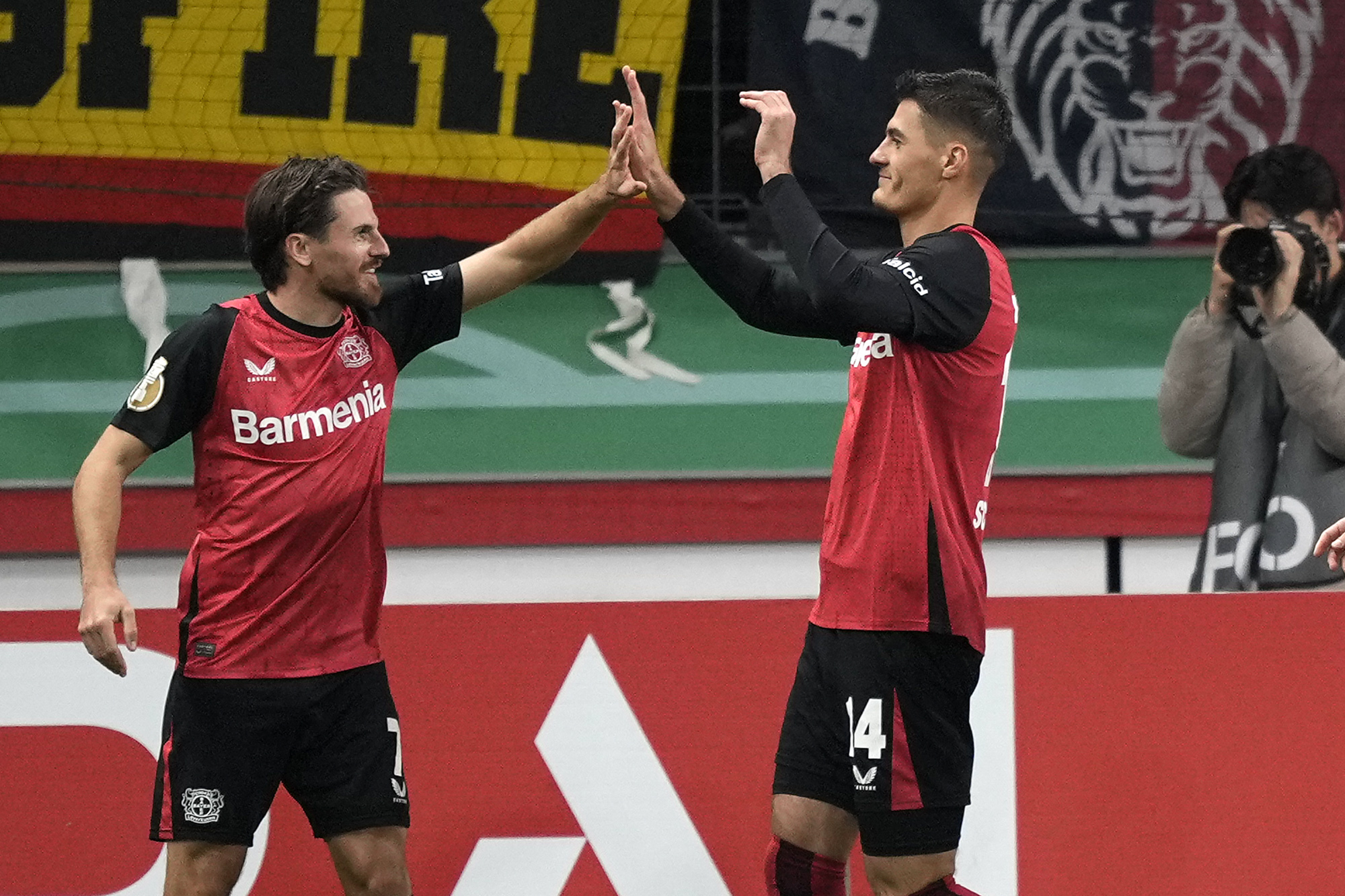 Leverkusen's scorer Patrik Schick, right, celebrates his opening goal with Leverkusen's Jonas Hofmann during the German Soccer Cup match between Bayer Leverkusen and SV Elversberg at the BayArena in Leverkusen, Germany, Tuesday, Oct. 29, 2024.