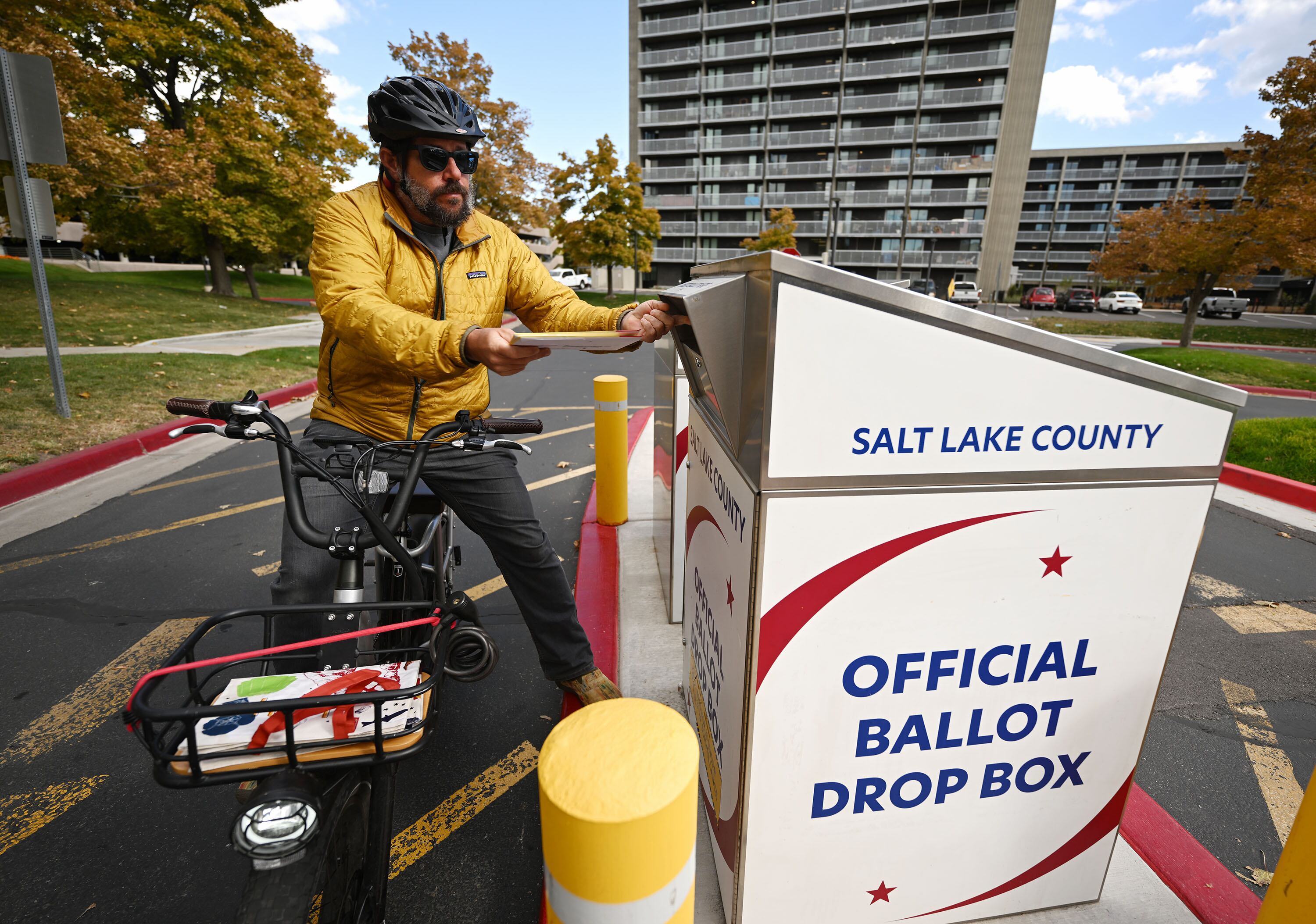 Paul Roberson, places his ballot into a drop box at the Salt Lake County Government Center on Monday. There are still several ways to return your ballots, but officials encourage voters to meet deadlines.