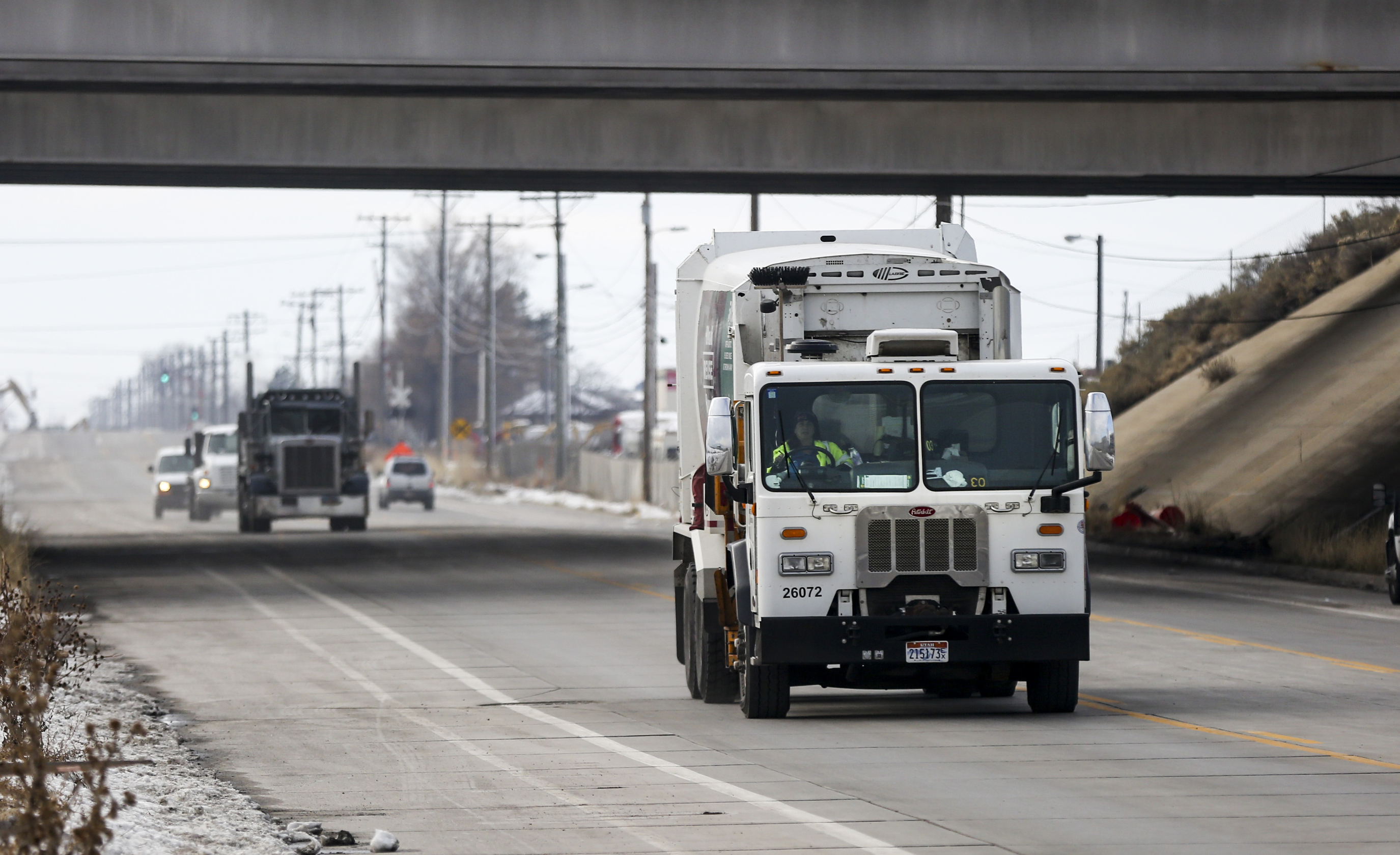 A diesel garbage truck drives along 500 South near the Salt Lake City Department of Public Services maintenance facility in Salt Lake City on Dec. 2, 2019.