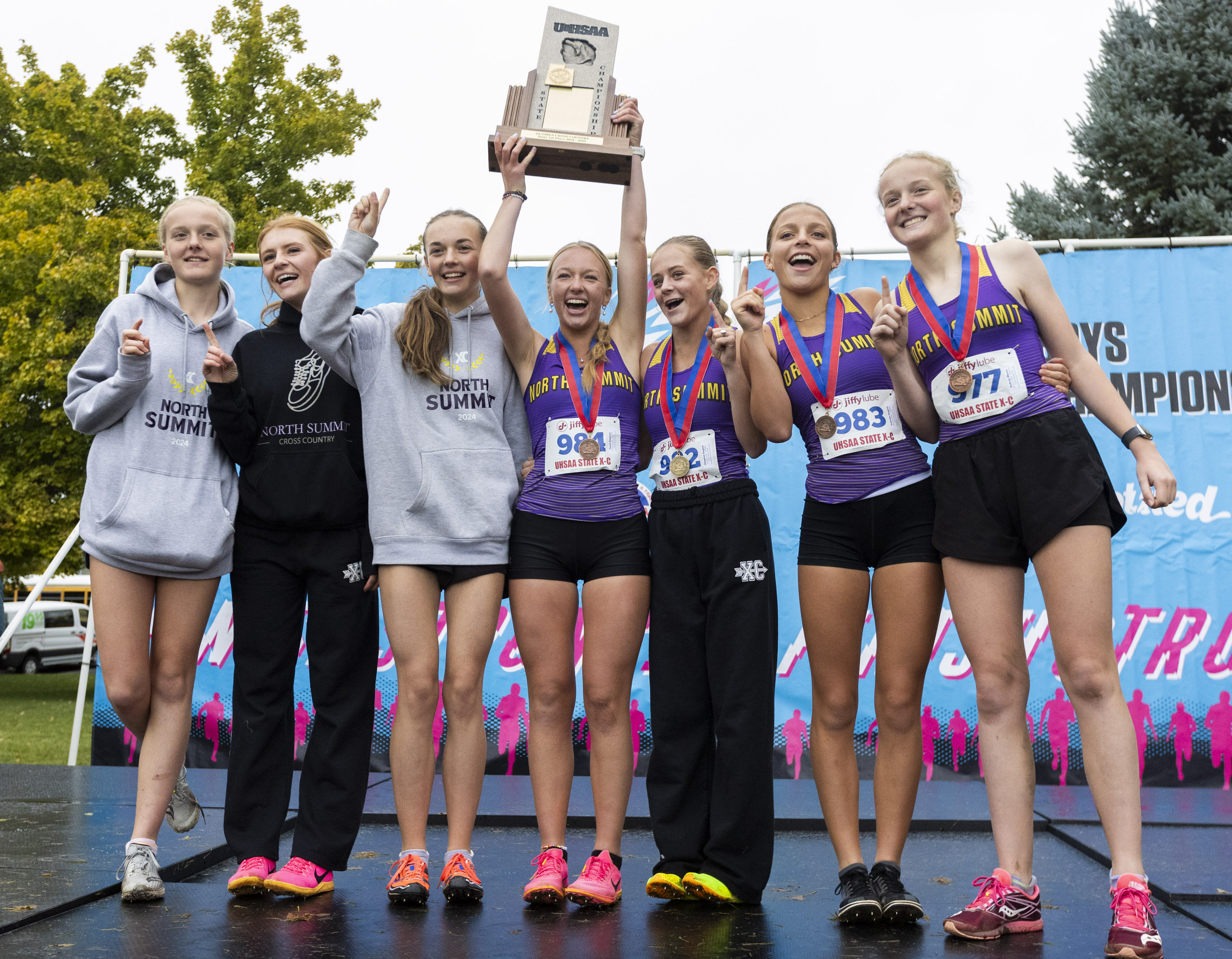 North Summit’s girl cross country team celebrates after winning first place in the 2A cross country state championships at Sugar House Park in Salt Lake City on Tuesday, Oct. 29, 2024.