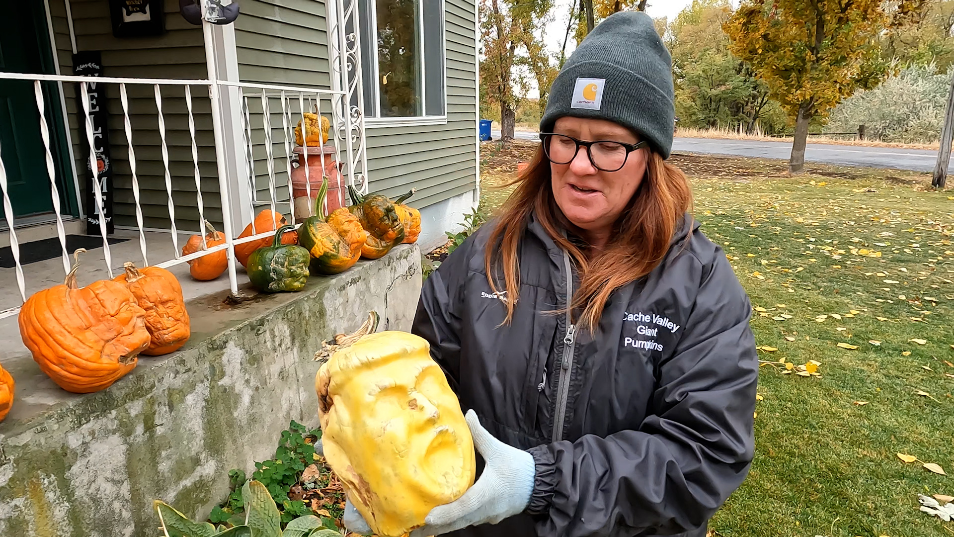 Katie Seamons holds a "Trumpkin" grown by her and her husband, Jim Seamons, in Benson, Cache County, on Tuesday.