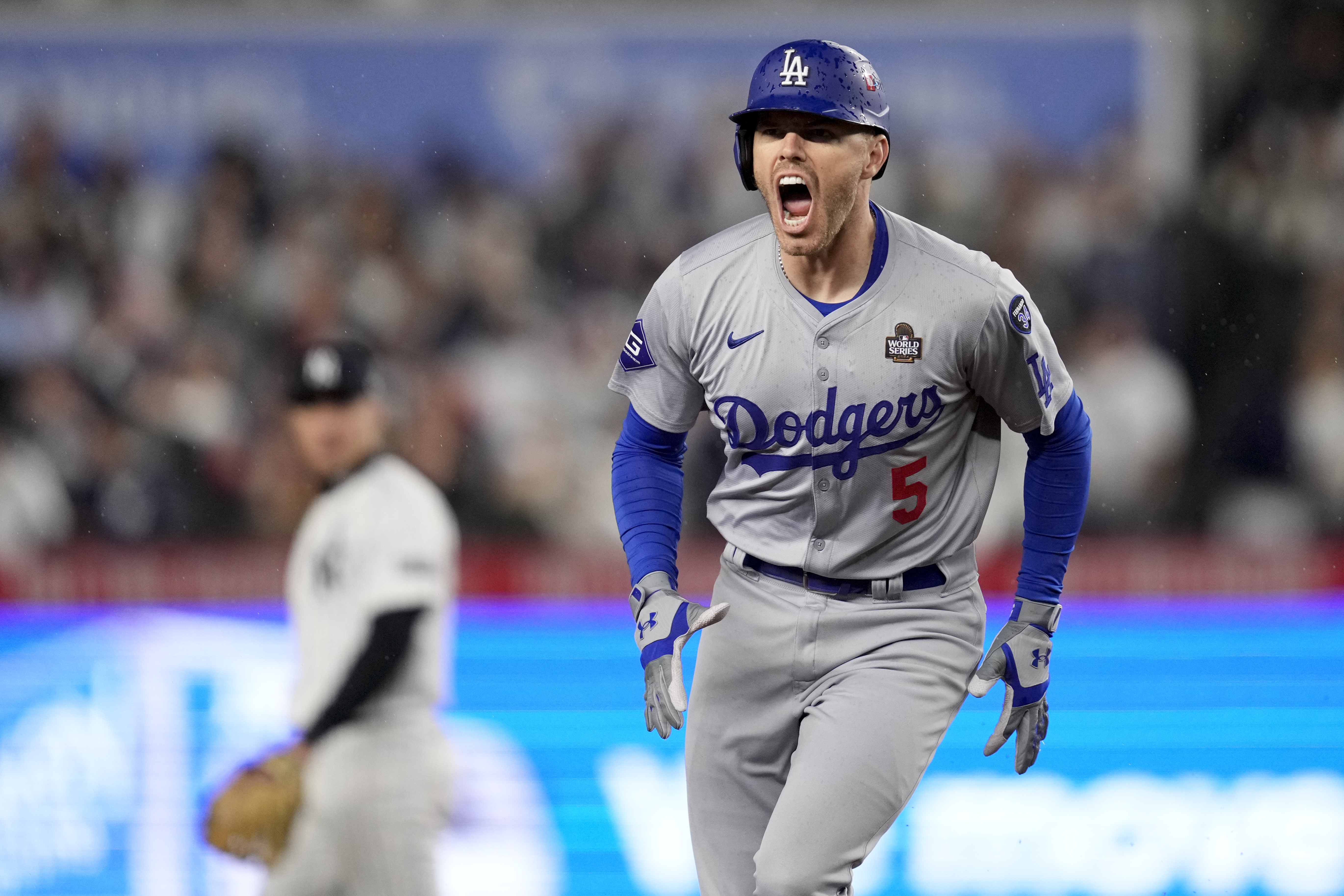 Los Angeles Dodgers' Freddie Freeman celebrates his two-run home run against the New York Yankees during the first inning in Game 4 of the baseball World Series, Tuesday, Oct. 29, 2024, in New York. 