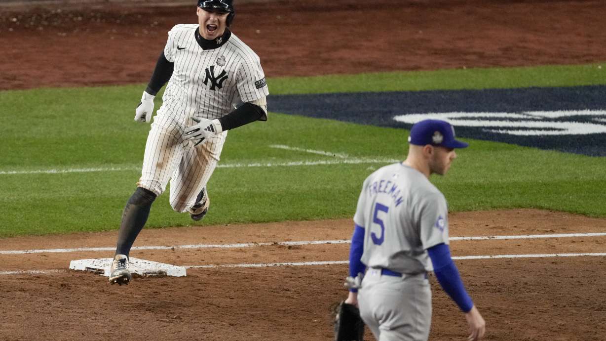 New York Yankees' Anthony Volpe celebrates his grand slam home run against the Los Angeles Dodgers during the third inning in Game 4 of the baseball World Series, Tuesday, Oct. 29, 2024, in New York.