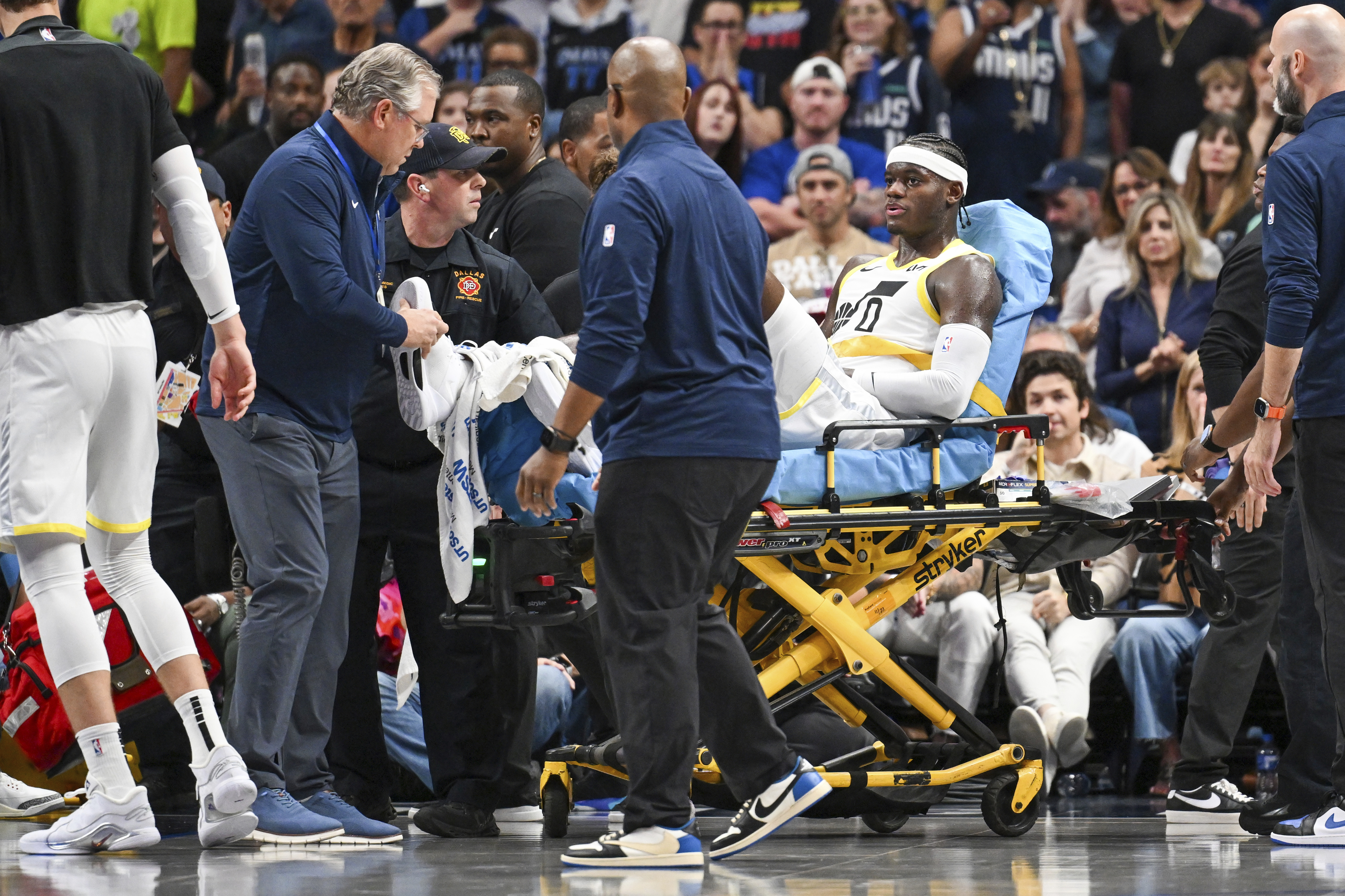 Utah Jazz forward Taylor Hendricks (0) is wheeled off by paramedics after sustaining an injury in the second half during an NBA basketball game against the Dallas Mavericks, Monday, Oct. 28, 2024, in Dallas. 