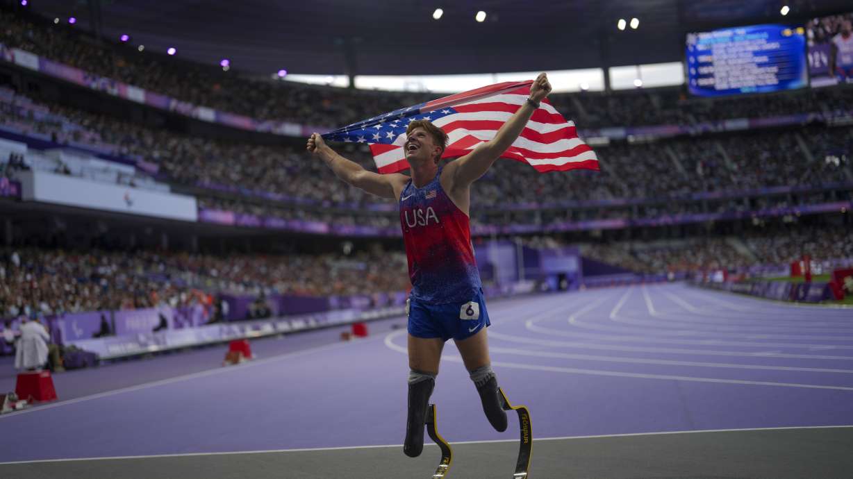 FILE - Hunter Woodhall from the U.S. celebrates after winning the men's 400 m. T62 final at the 2024 Paralympics, Friday, Sept. 6, 2024, in Paris, France.