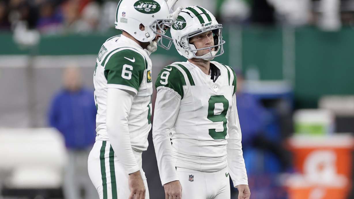 New York Jets place kicker Greg Zuerlein (9) reacts after missing a field goal attempt with Thomas Morstead during the second half of an NFL football game against the Buffalo Bills in East Rutherford, N.J., Monday, Oct. 14, 2024.