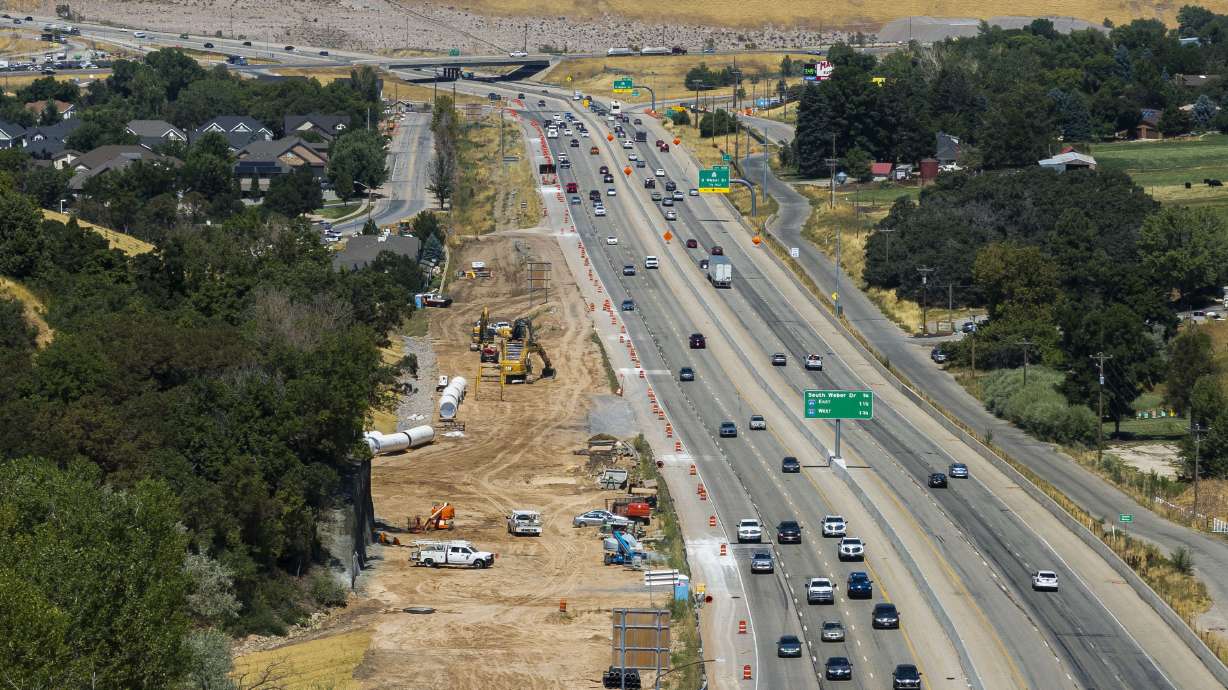 Construction continues on the Davis Aqueduct Reach 1 Parallel Pipeline along U.S. Route 89 in Layton on Aug. 9. A man was charged with assault Wednesday after police say he crashed into a construction zone off Highway 89 and fled.