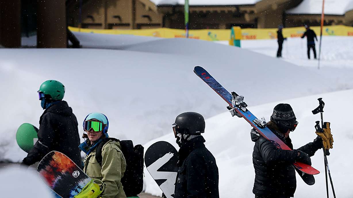 Skiers and snowboarders walk to the lifts at Snowbasin Resort in Ogden on Jan. 25, 2017. Seven Utah ski and snowboard areas made SKI magazine's top 30 list for resorts in the West based on its annual reader's survey.