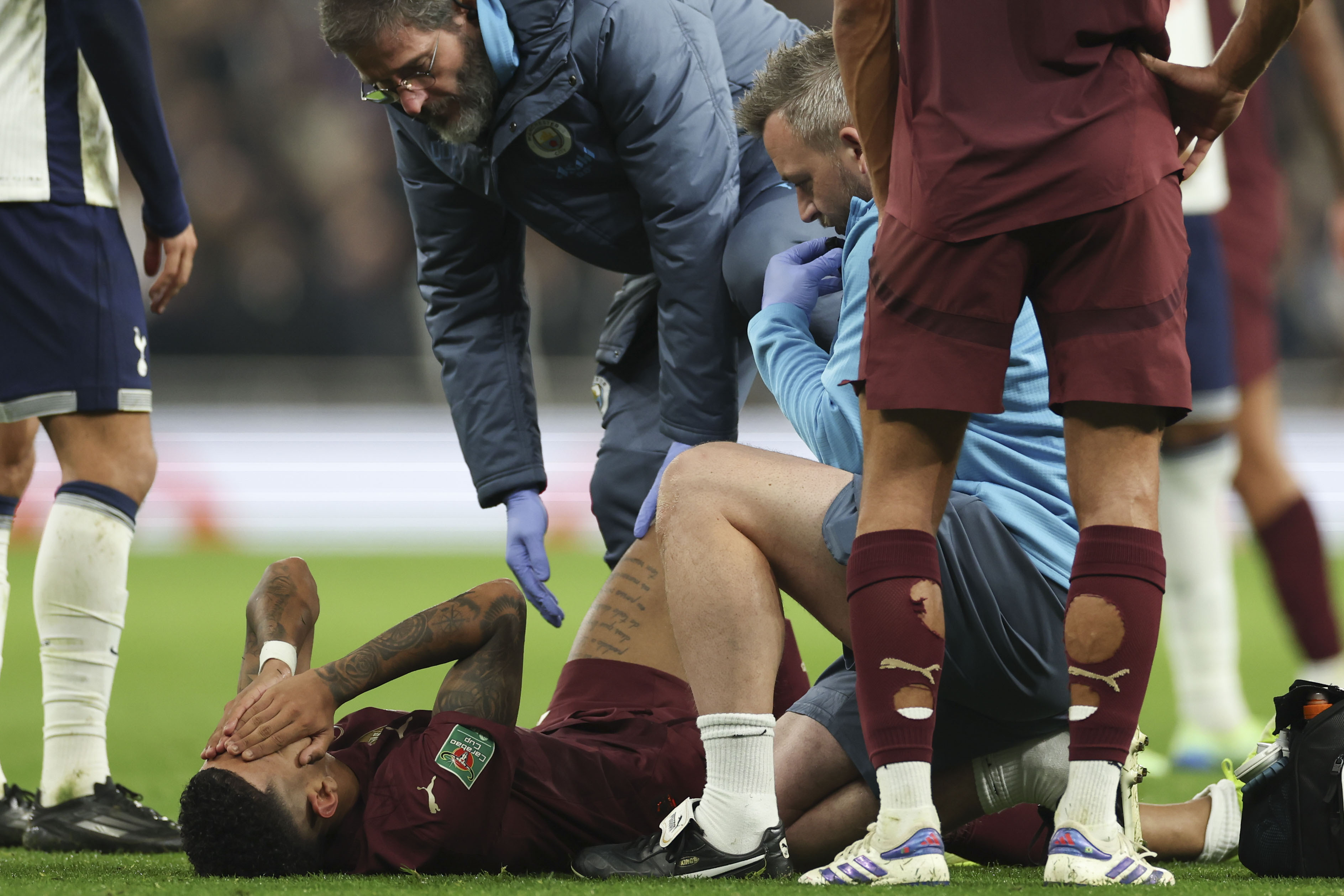 Manchester City's Savinho reacts after sustaining an injury during the English League Cup fourth round soccer match between Tottenham and Manchester City, at the Tottenham Hotspur Stadium in London, Wednesday, Oct 30, 2024. 