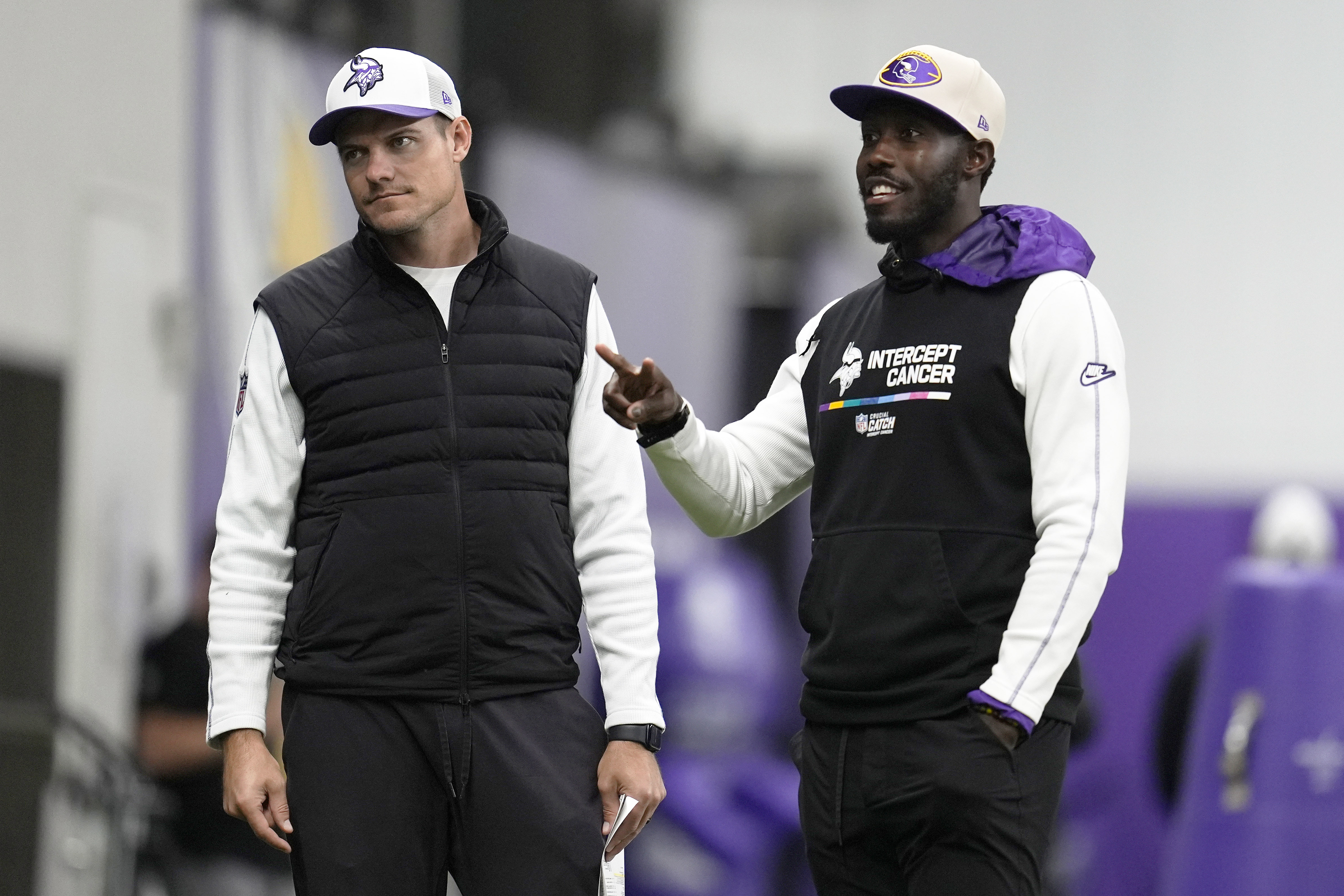 Minnesota Vikings head coach Kevin O'Connell, left, and general manager Kwesi Adofo-Mensah stand on the field during an NFL football workout in Eagan, Minn., Wednesday, Oct. 30, 2024.