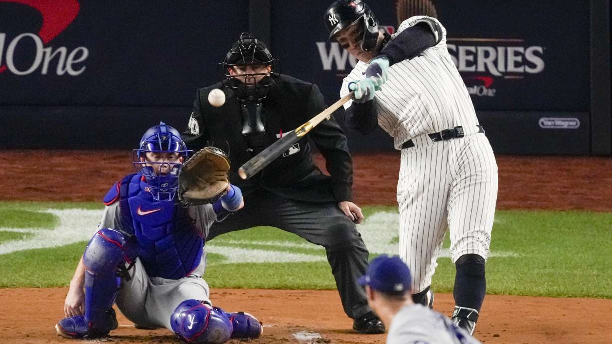 New York Yankees' Aaron Judge hits a two-run home run against the Los Angeles Dodgers during the first inning in Game 5 of the baseball World Series, Wednesday, Oct. 30, 2024, in New York.